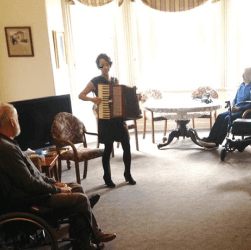 Lucy performing at an aged care centre.