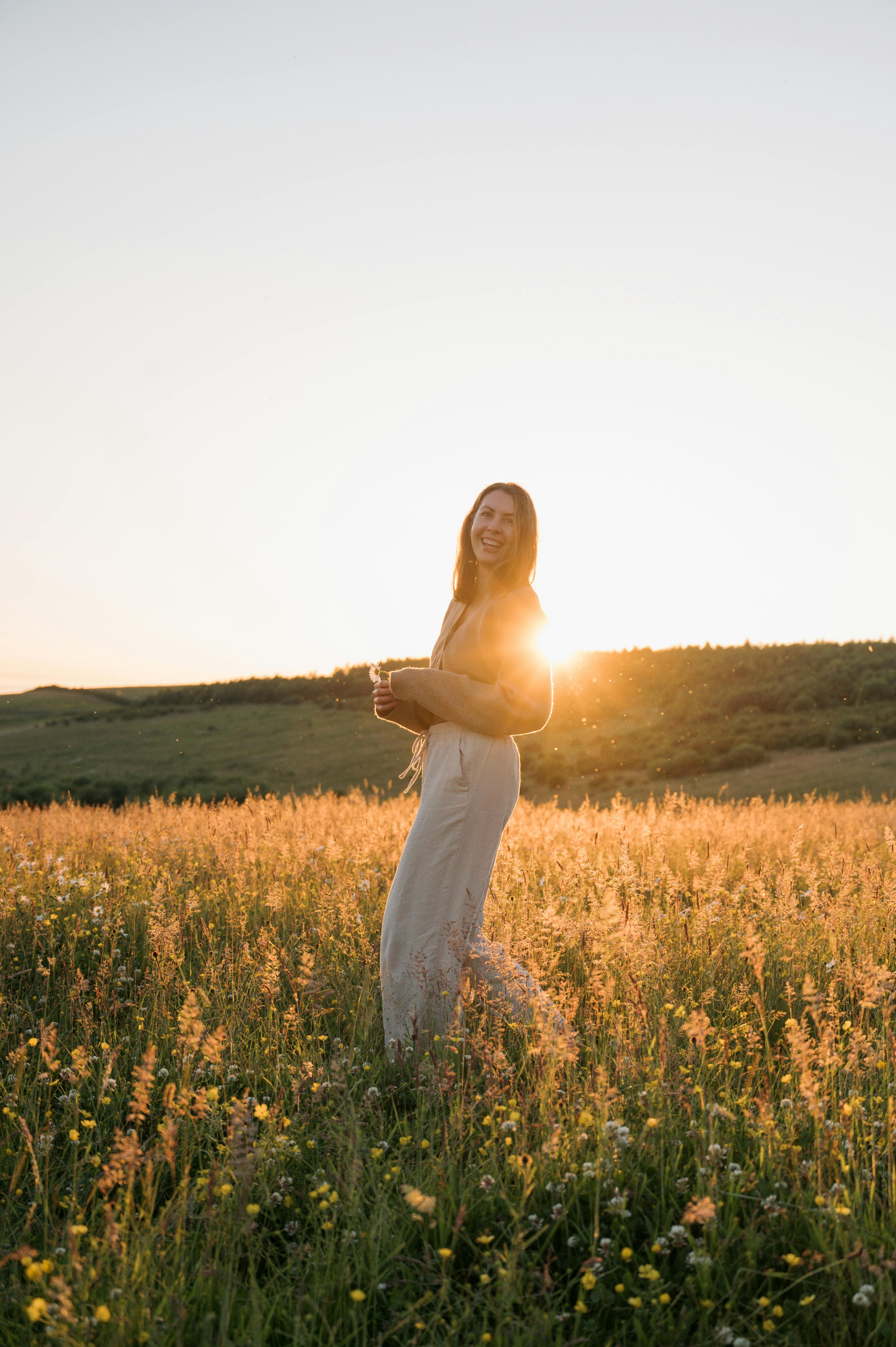Smiling woman standing in a field