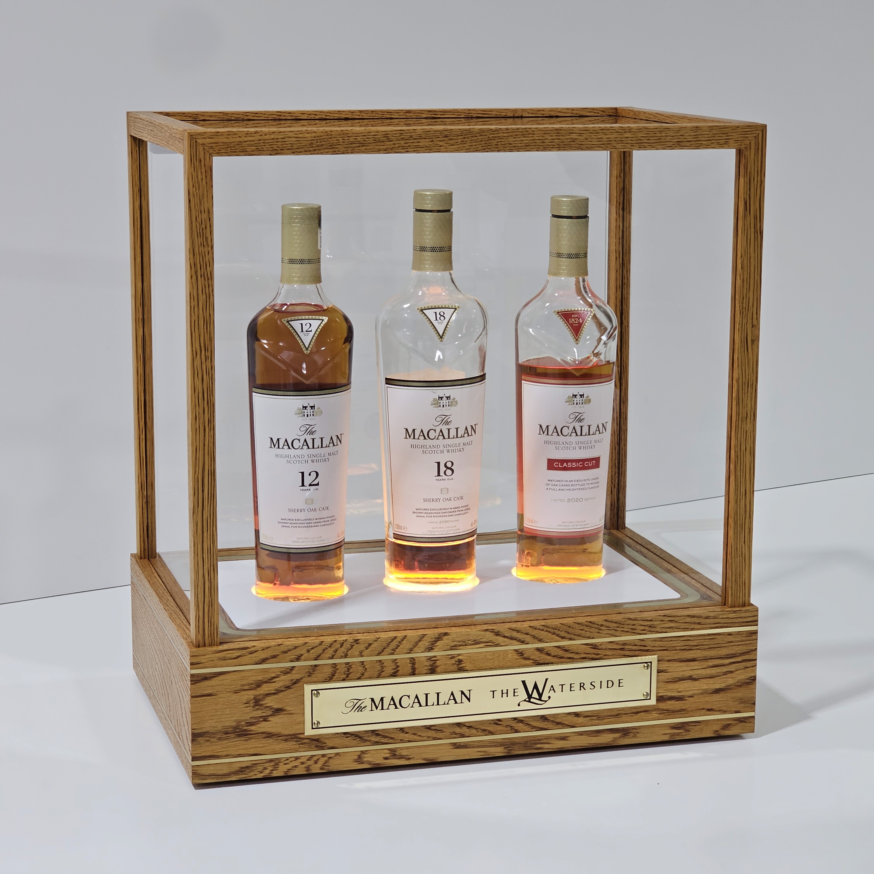 Display case and cabinet design for a furniture piece showcasing a whisky brand