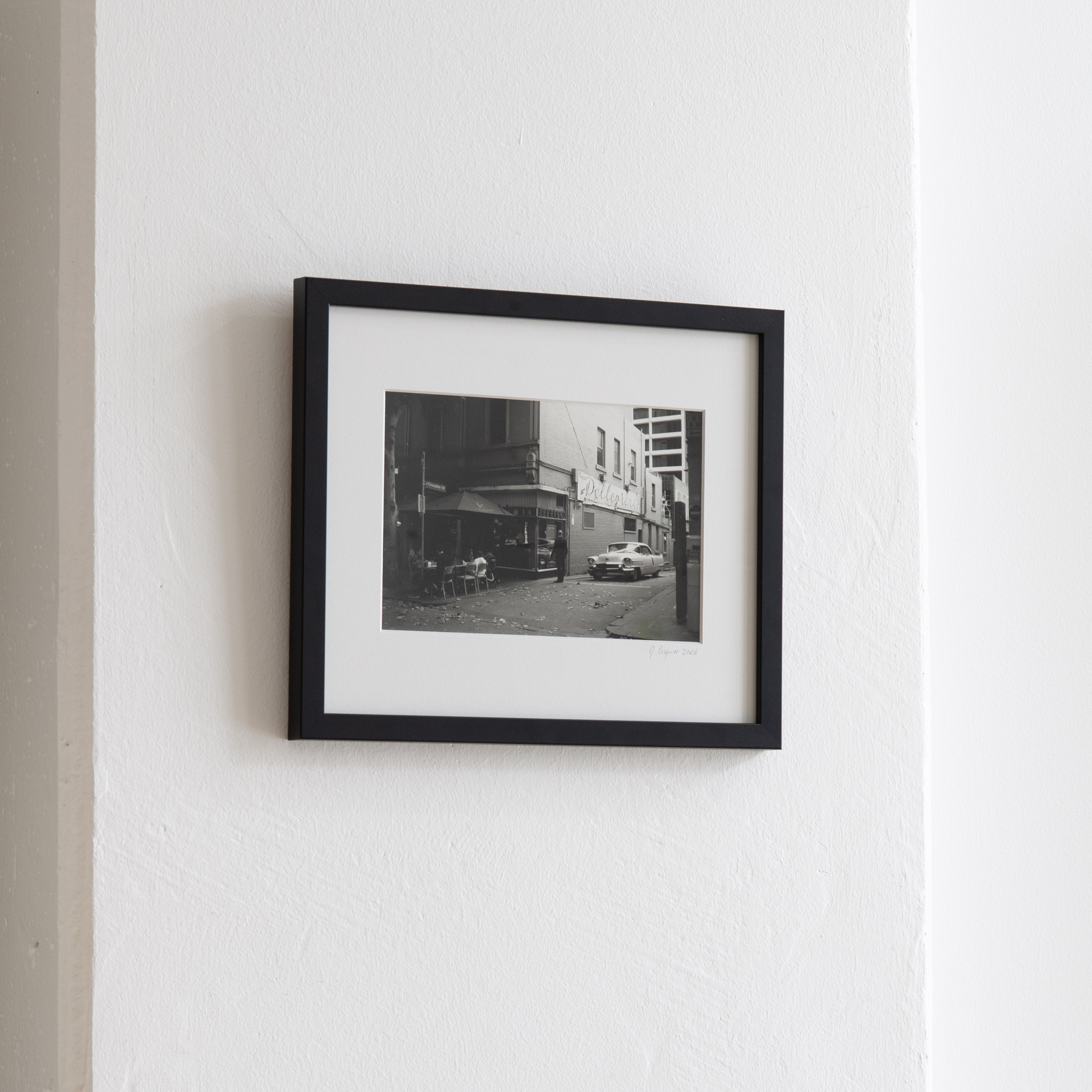 Darkroom prints drying on wire racks