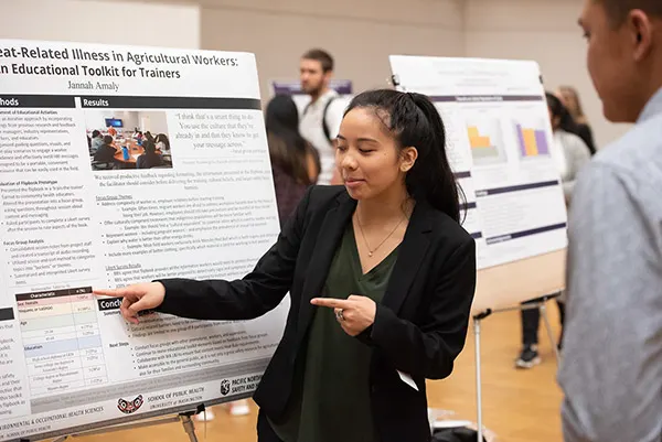 High school students presenting research at RISE Research summer programs in STEM and public health, gaining Ivy League–mentored experience through academic conferences.
