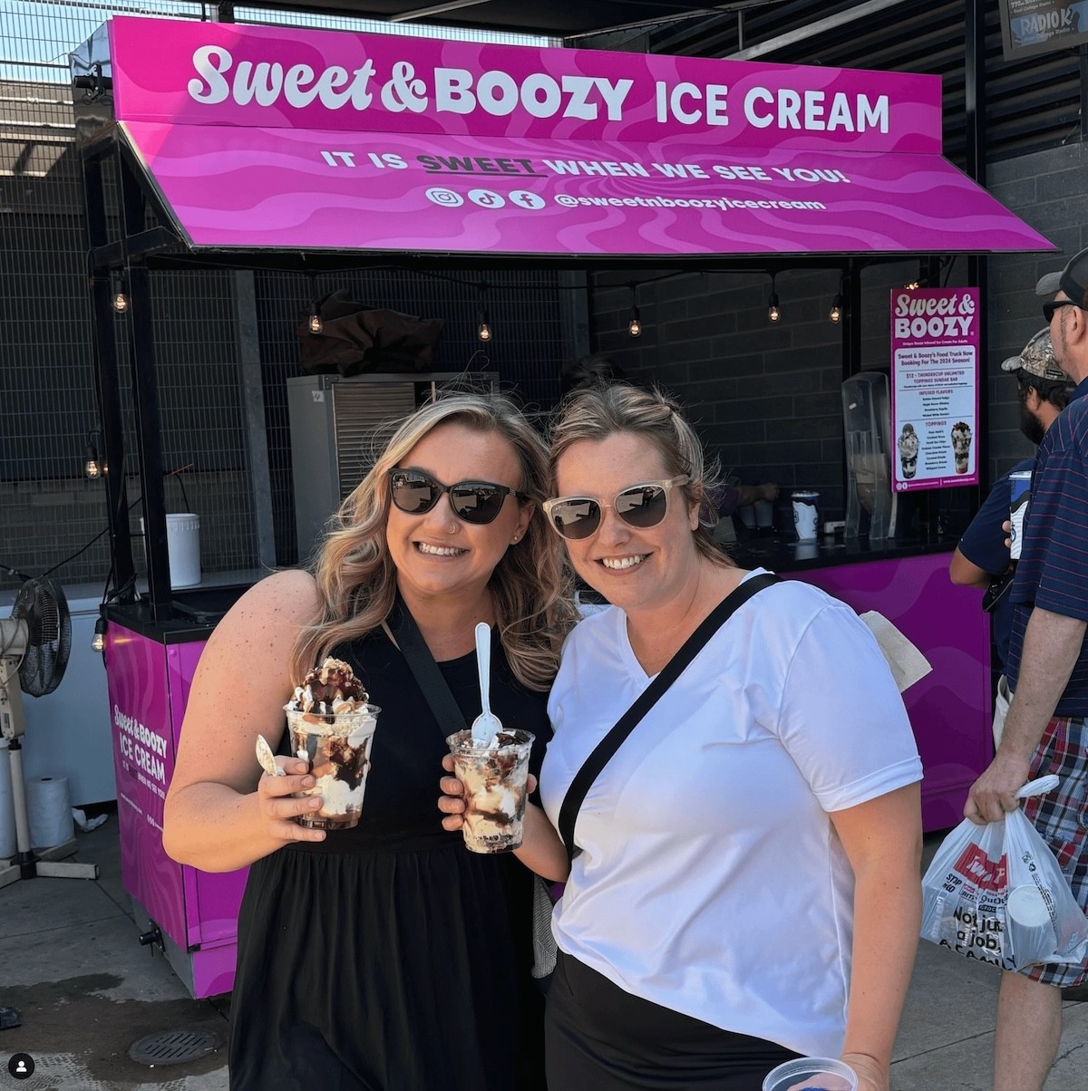 Sweet & Boozy Customers posed infront of Sweet & Boozy cart