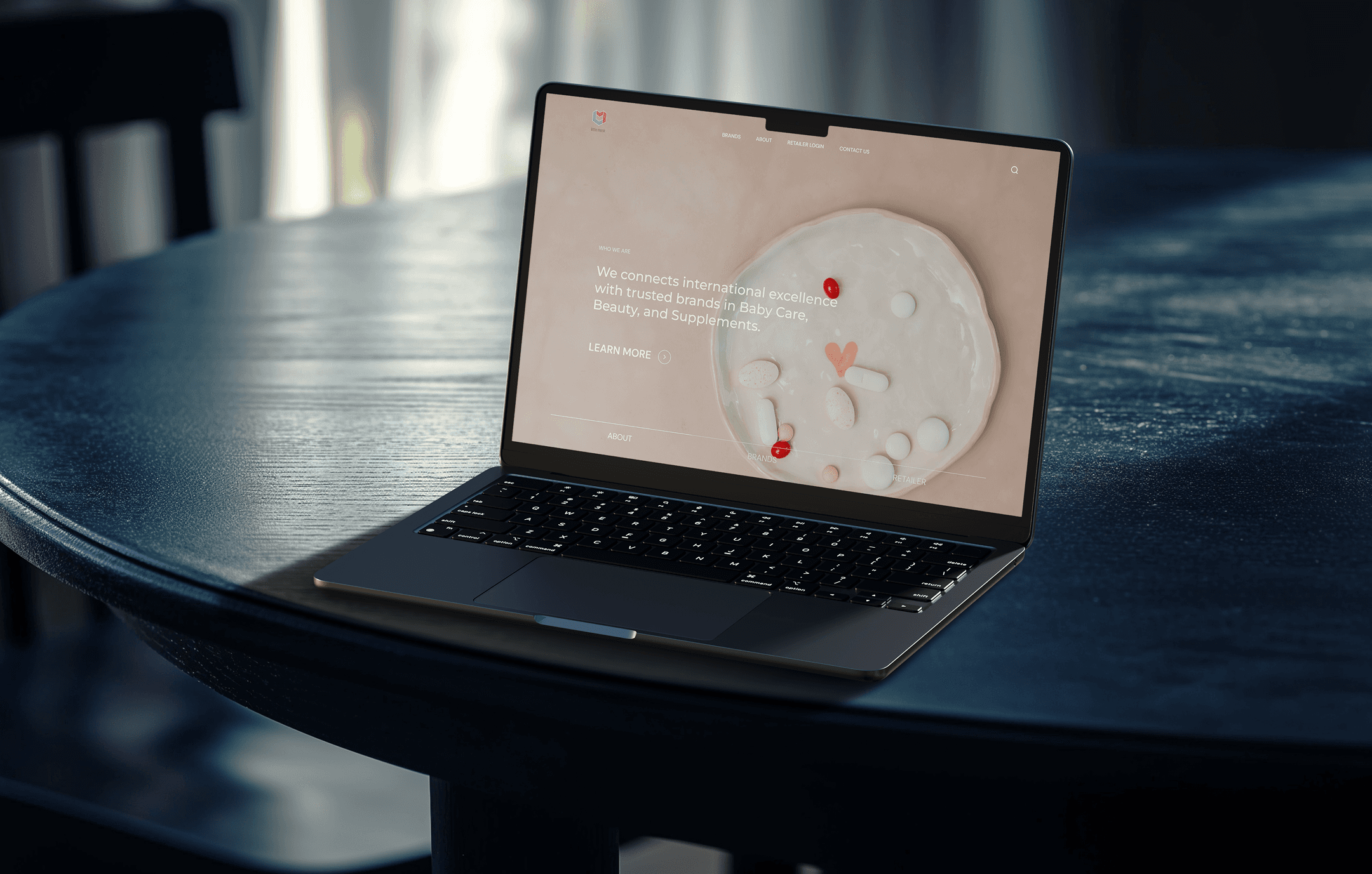 "Open laptop displaying the Little Monk website, showcasing international excellence in baby care, beauty, and supplements on a modern, clean interface."