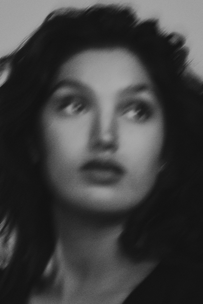 Creative editorial portrait of director of photography and cinematographer Reyna Hope. The image is expressive, shot with motion blur in Craig Mulcahy’s New Orleans studio. 