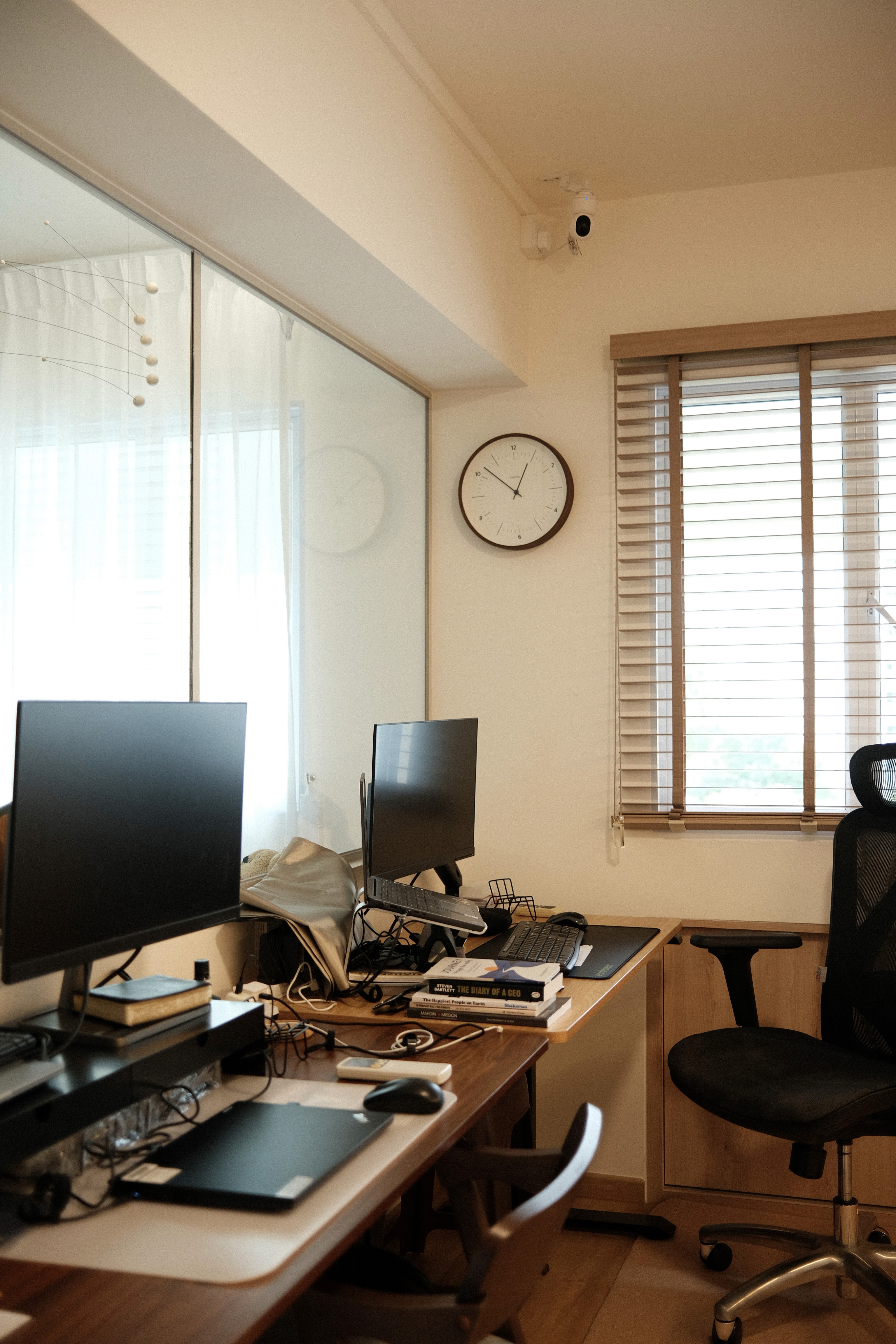 A calm, functional workspace softened by natural light, warm materials, and a simple layout that supports focused work at home.