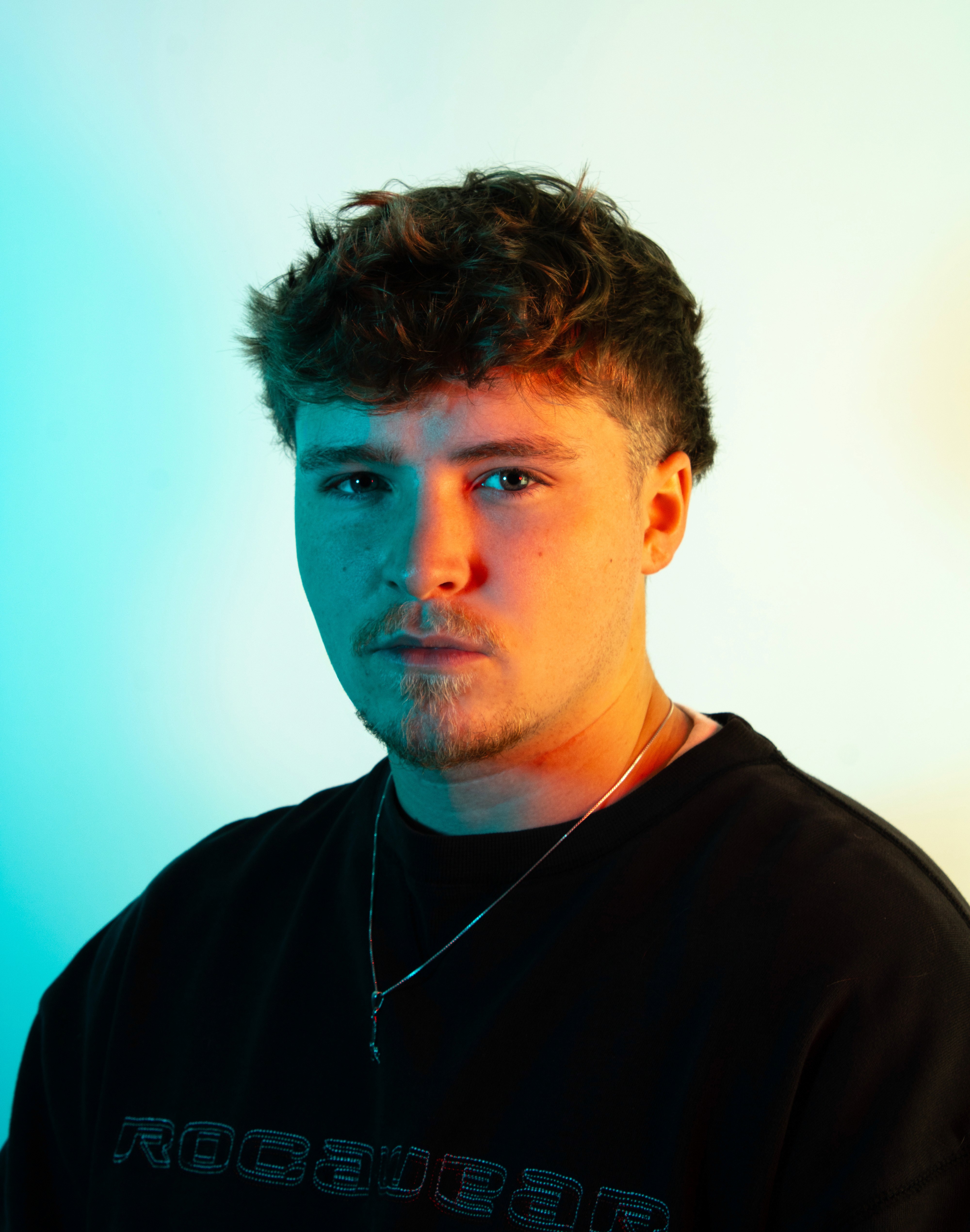 a blurry photo of a person standing in front of a wall