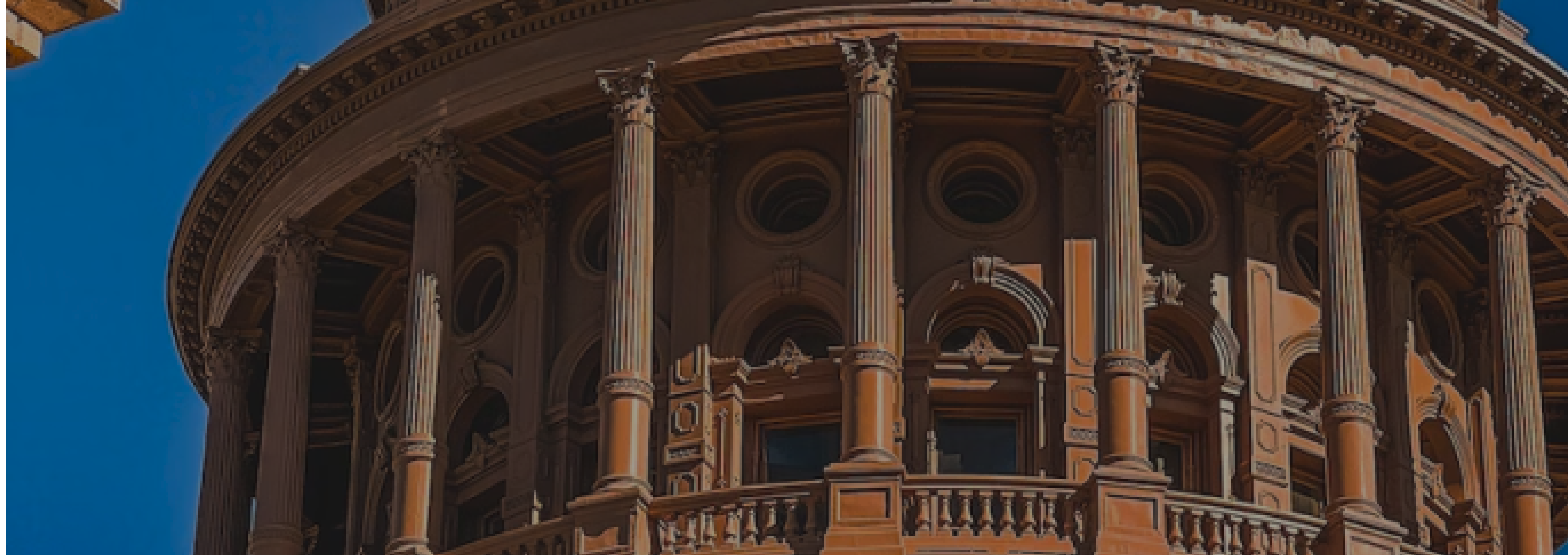 image of a state house building against a blue sky