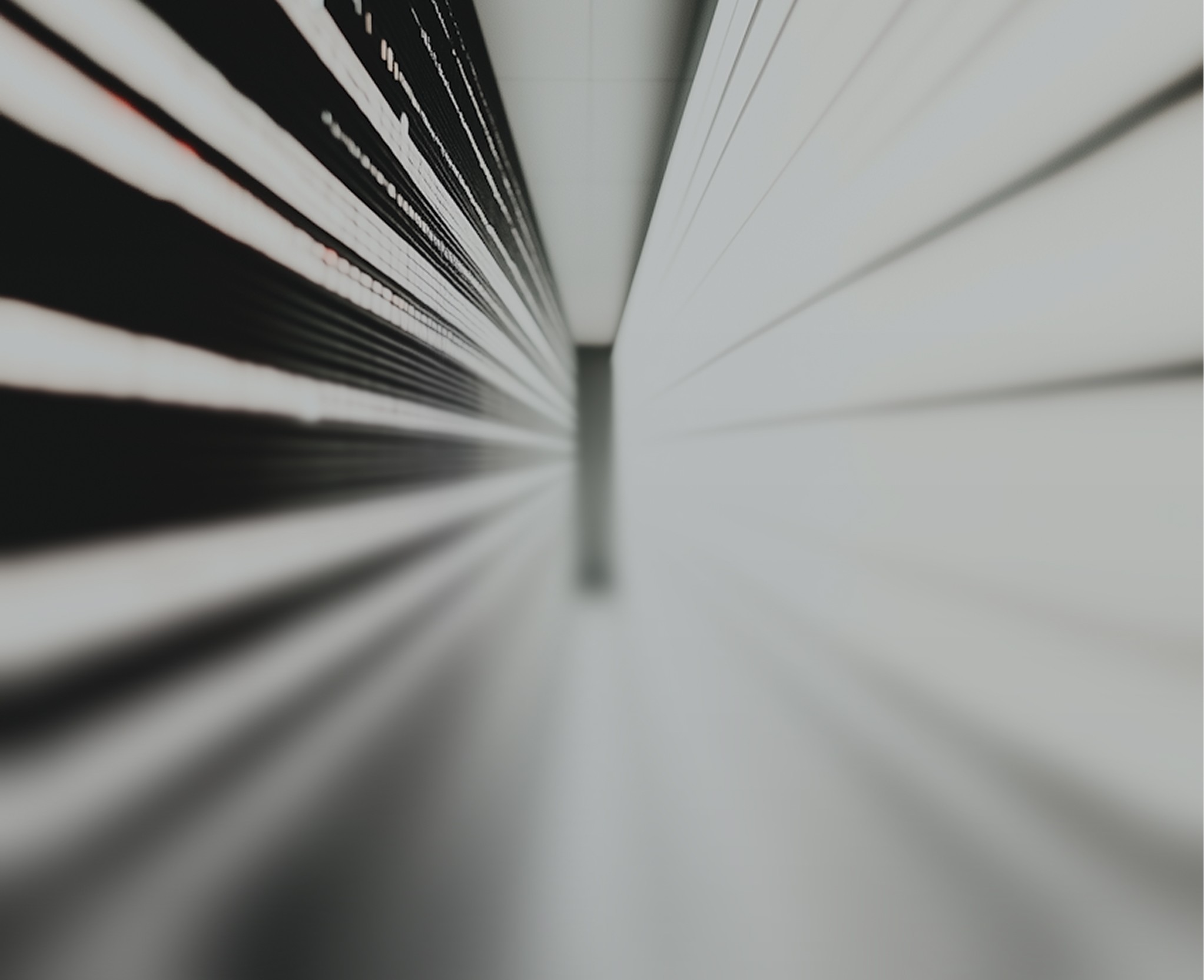 Abstract perspective view of two parallel walls with glowing lines, creating a futuristic and geometric effect.