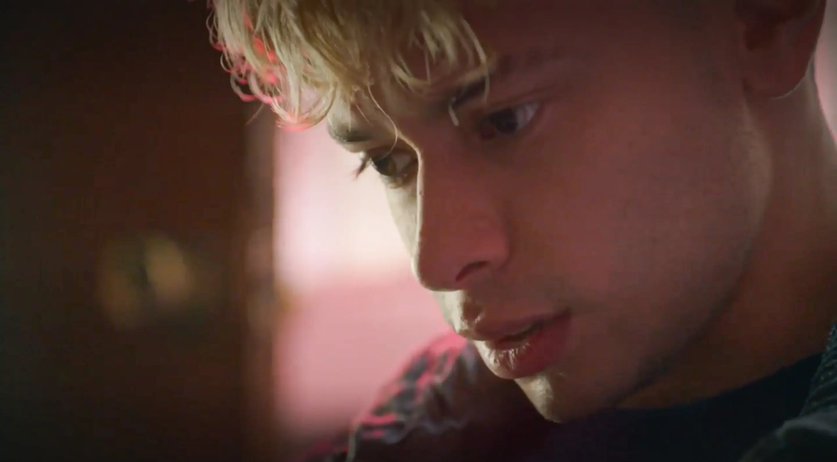 a woman holding a red flower