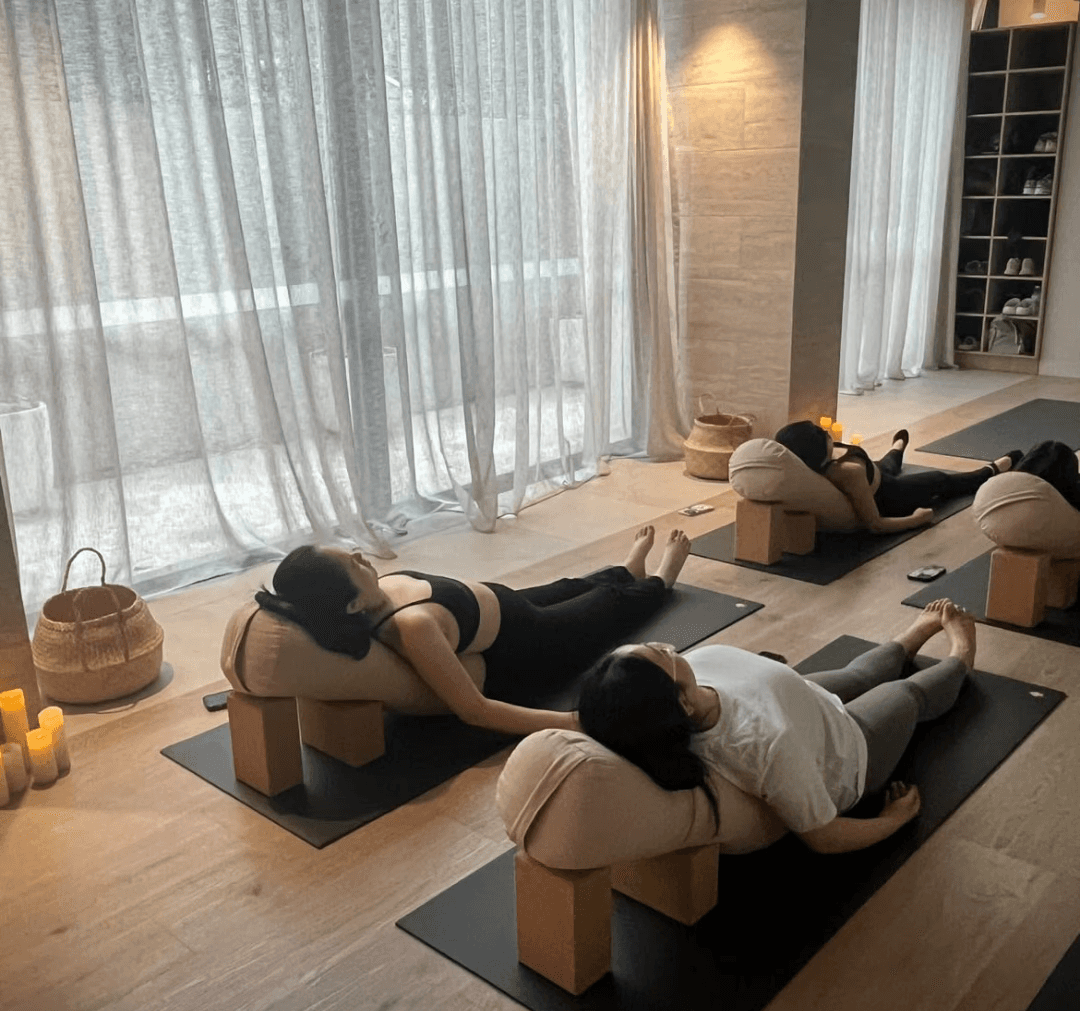 Spacious yoga studio with clean floors and calming ambiance.