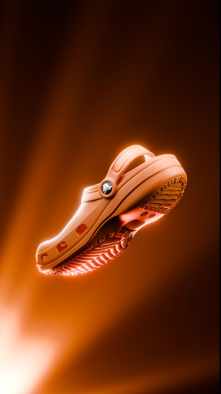 A person stands against a vibrant background of orange and yellow wavy patterns. They are wearing a dark coat, looking contemplative and thoughtful.