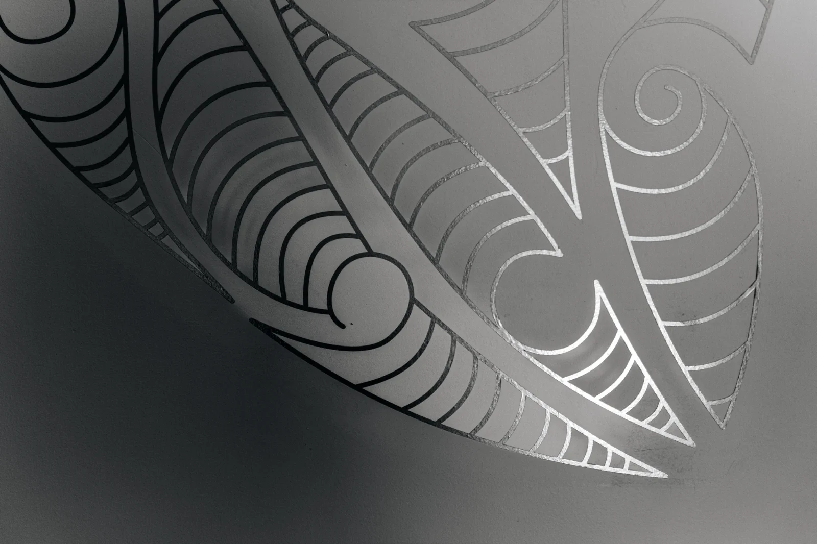 Grey koru wall pattern