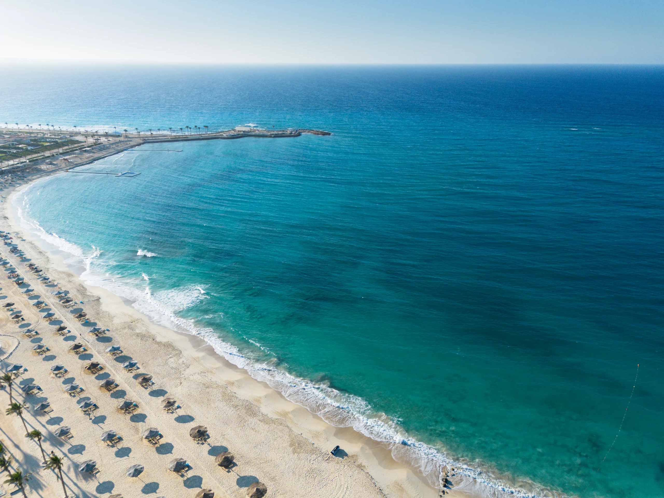 Wide aerial view of the Mediterranean shoreline at Caesar, Ras El Hekma, North Coast.