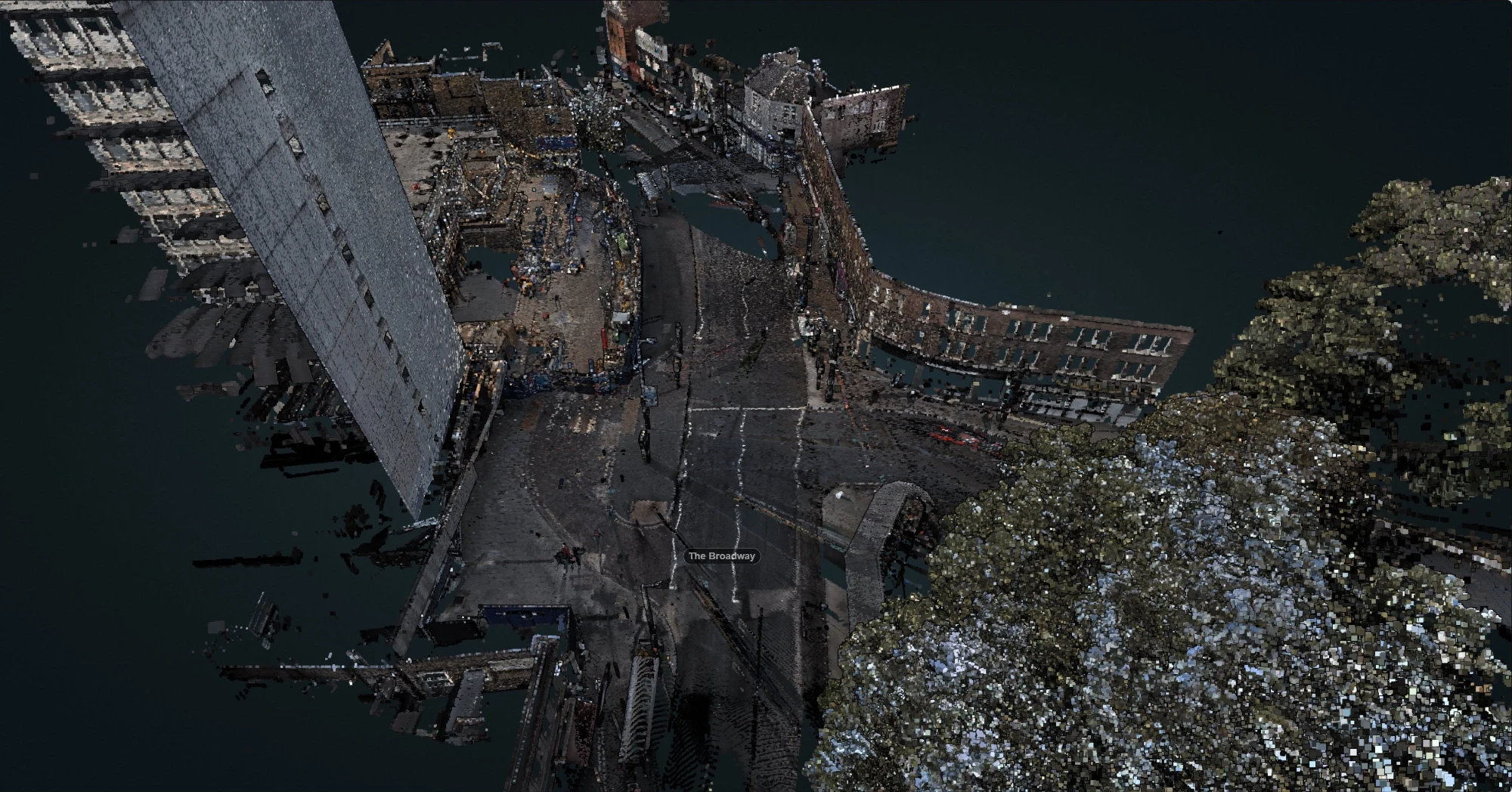 Detailed 3D point cloud model of an urban streetscape and building facades, generated from high-density laser scan data