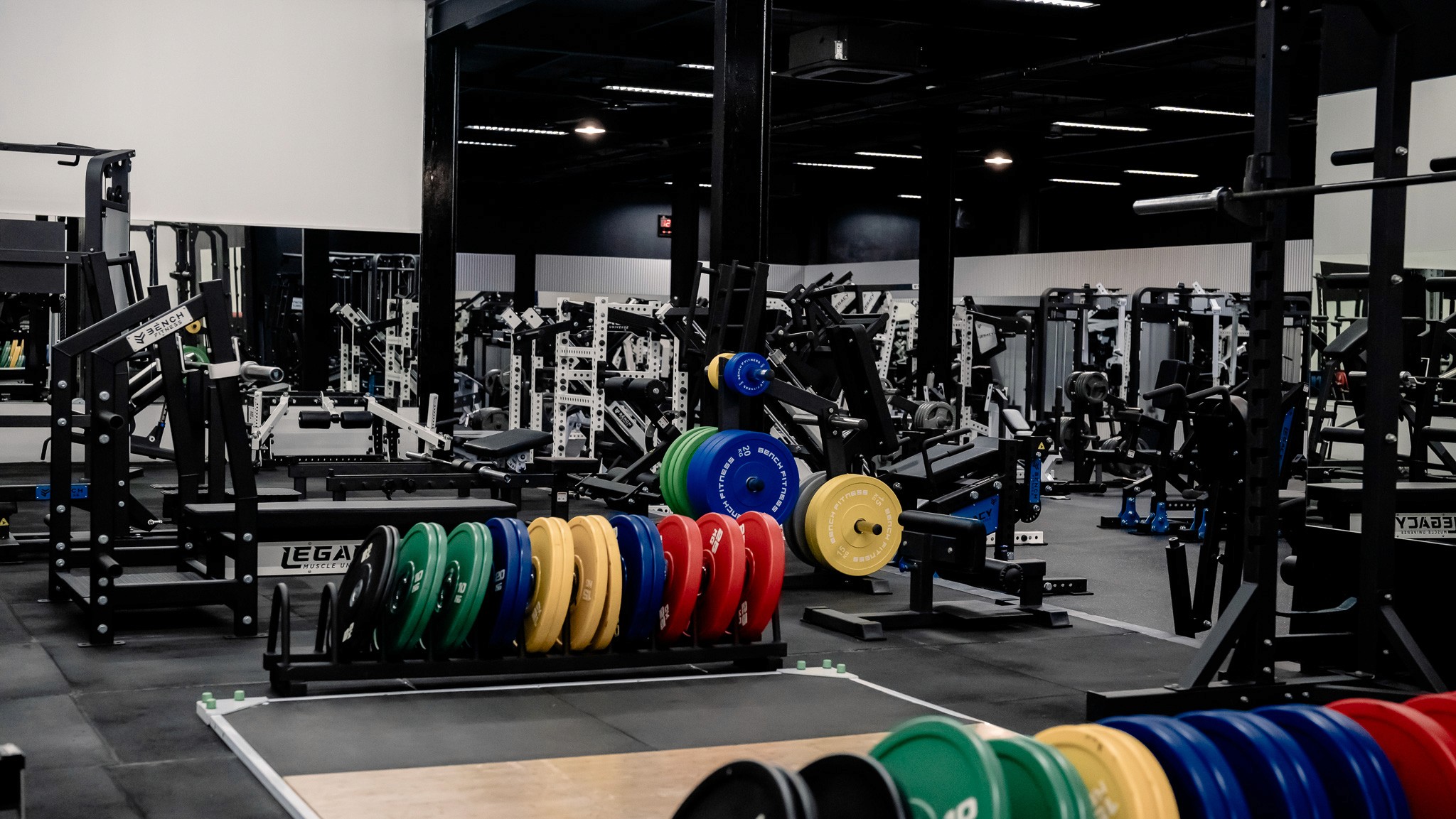 State-of-the-art gym at Legacy Muscle Universe Koh Samui with advanced strength and cardio equipment in a spacious, air-conditioned fitness facility.