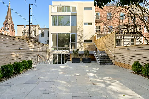 Garden and rear facade of 14 Wyckoff Street in Cobble Hill