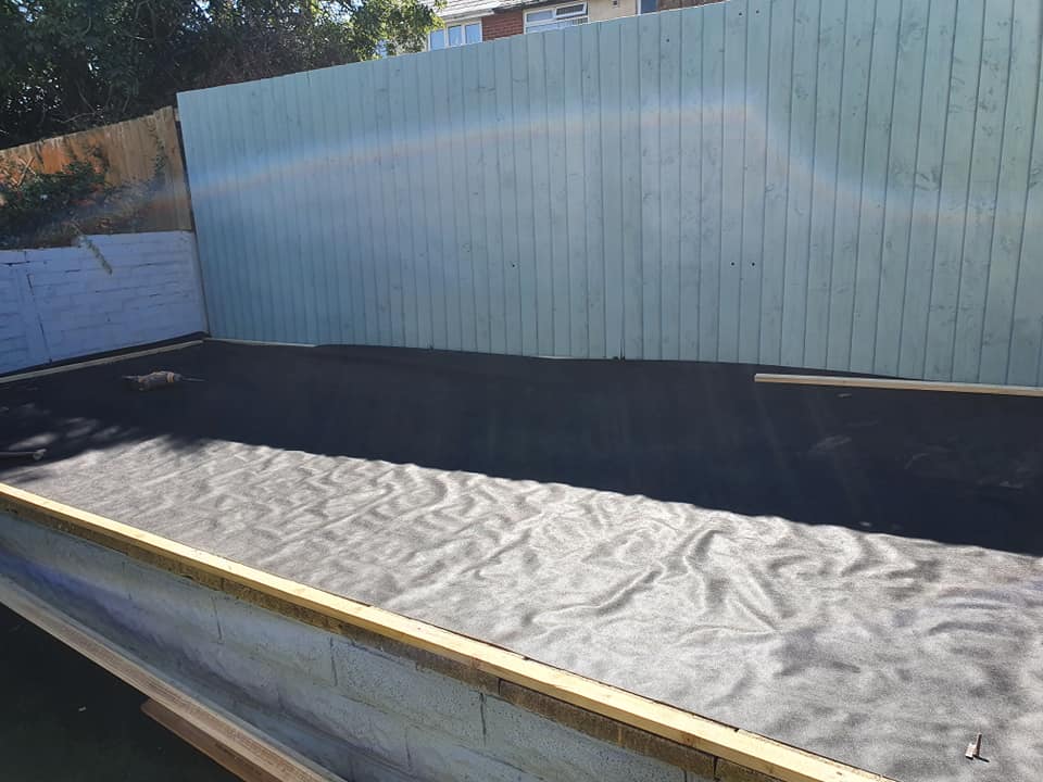 A man inspects equipment in a modern factory.