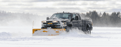 Truck plowing snow in the winter