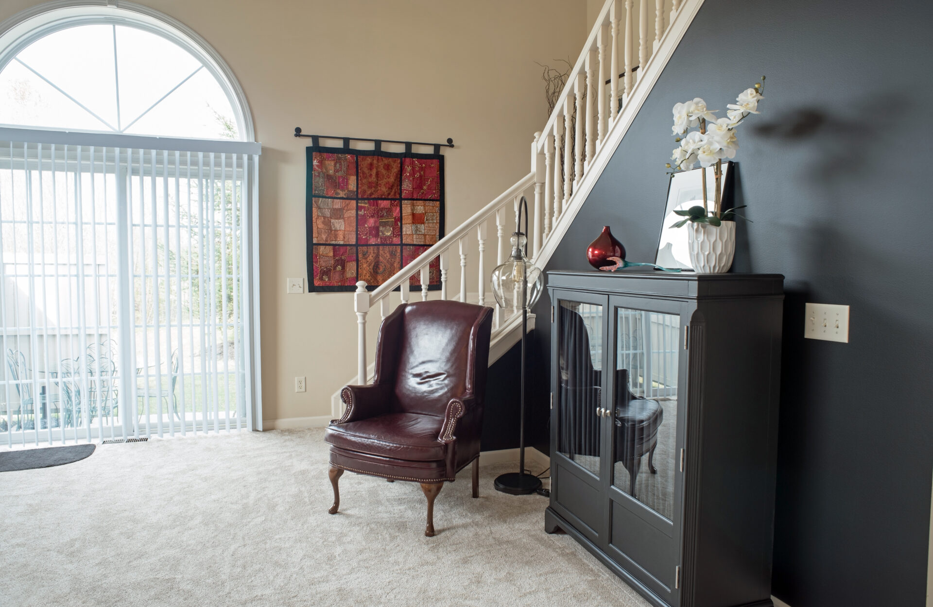 Living Room in Black & Red Décor and vertical blinds. Wholesale Blind Factory
