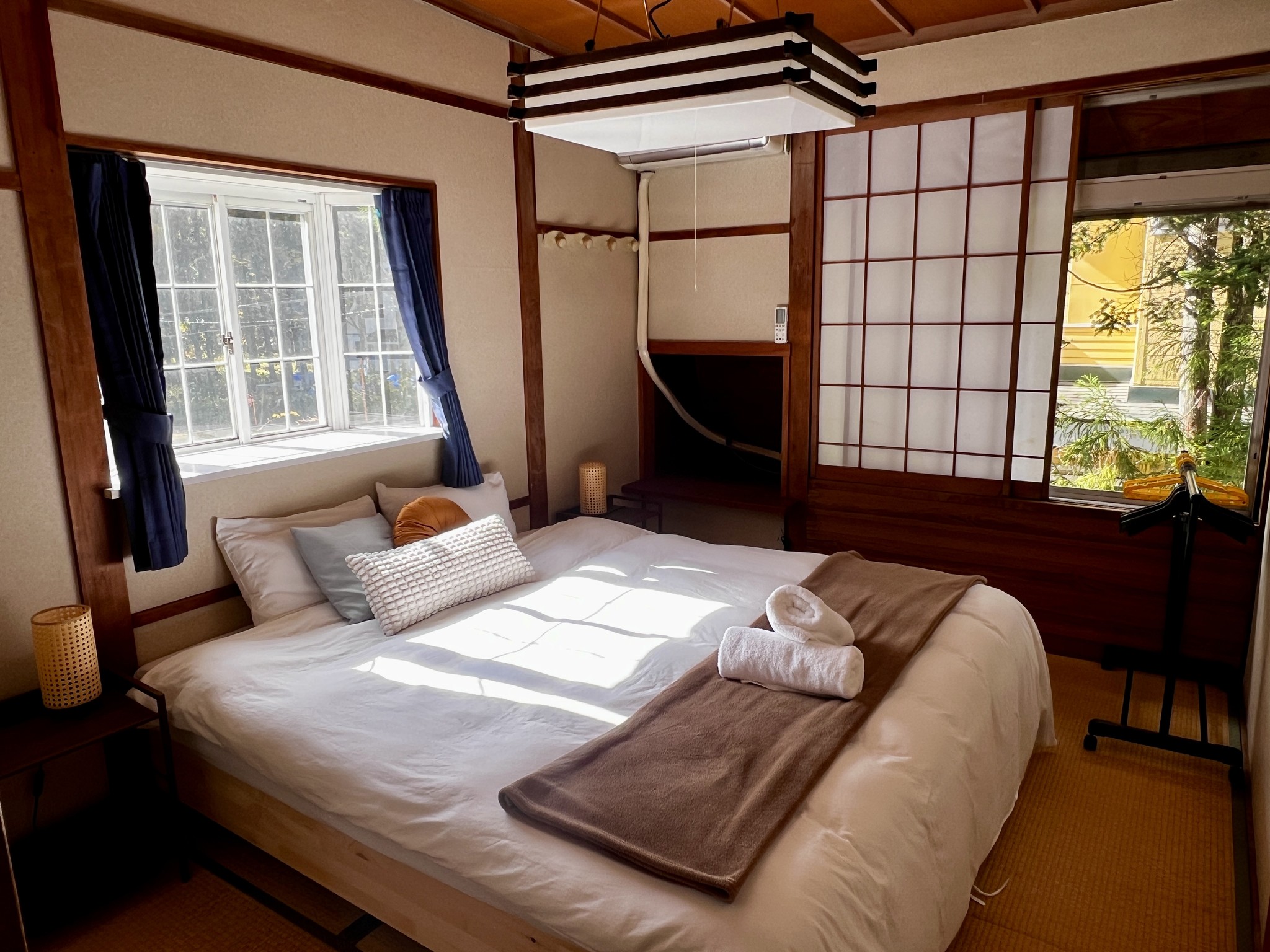 A cosy room with traditional Japanese design elements. The twin beds can be joined to create a spacious king bed. Ideal for couples or friends seeking a cultural experience.