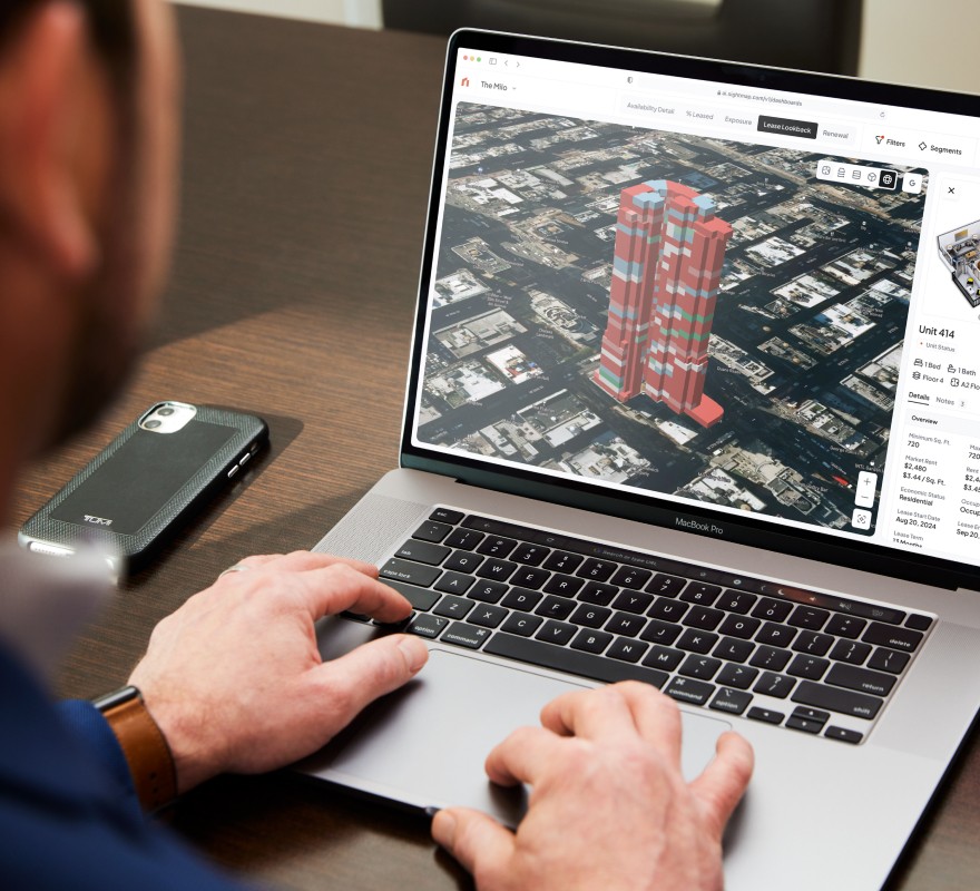 Person viewing a 3D building rendering in Asset Intelligence.