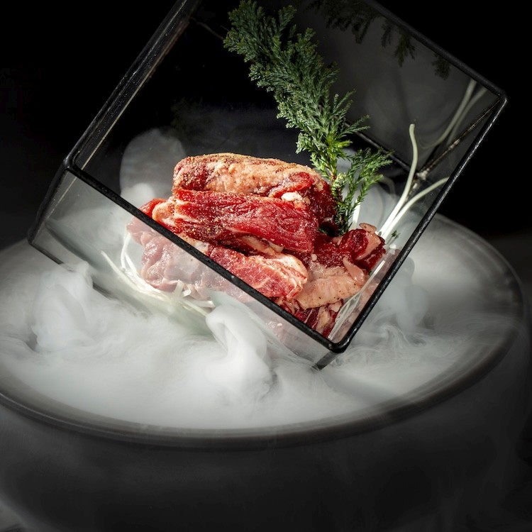 a bowl of ramen with chopsticks sticking out of it