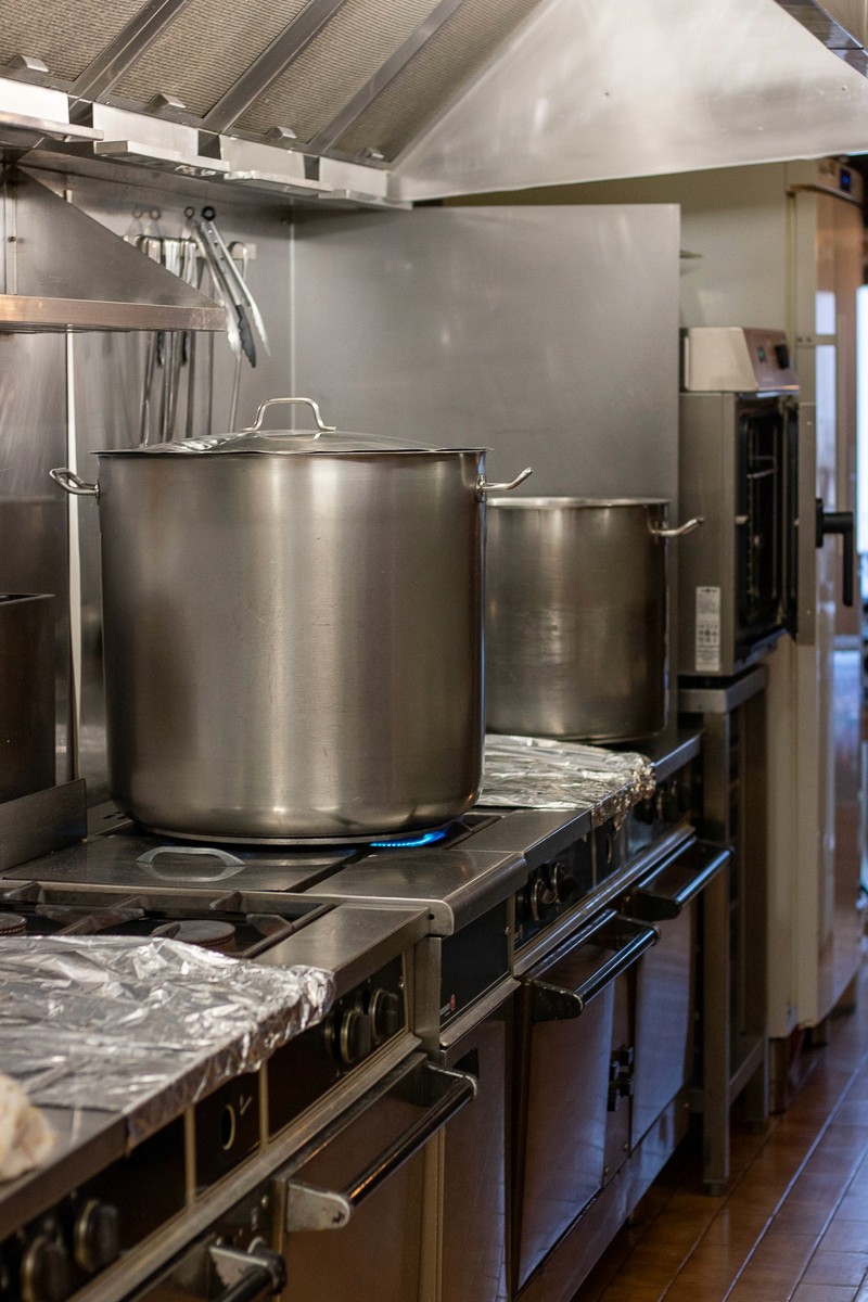 selective focus photo of brown and blue hourglass on stones