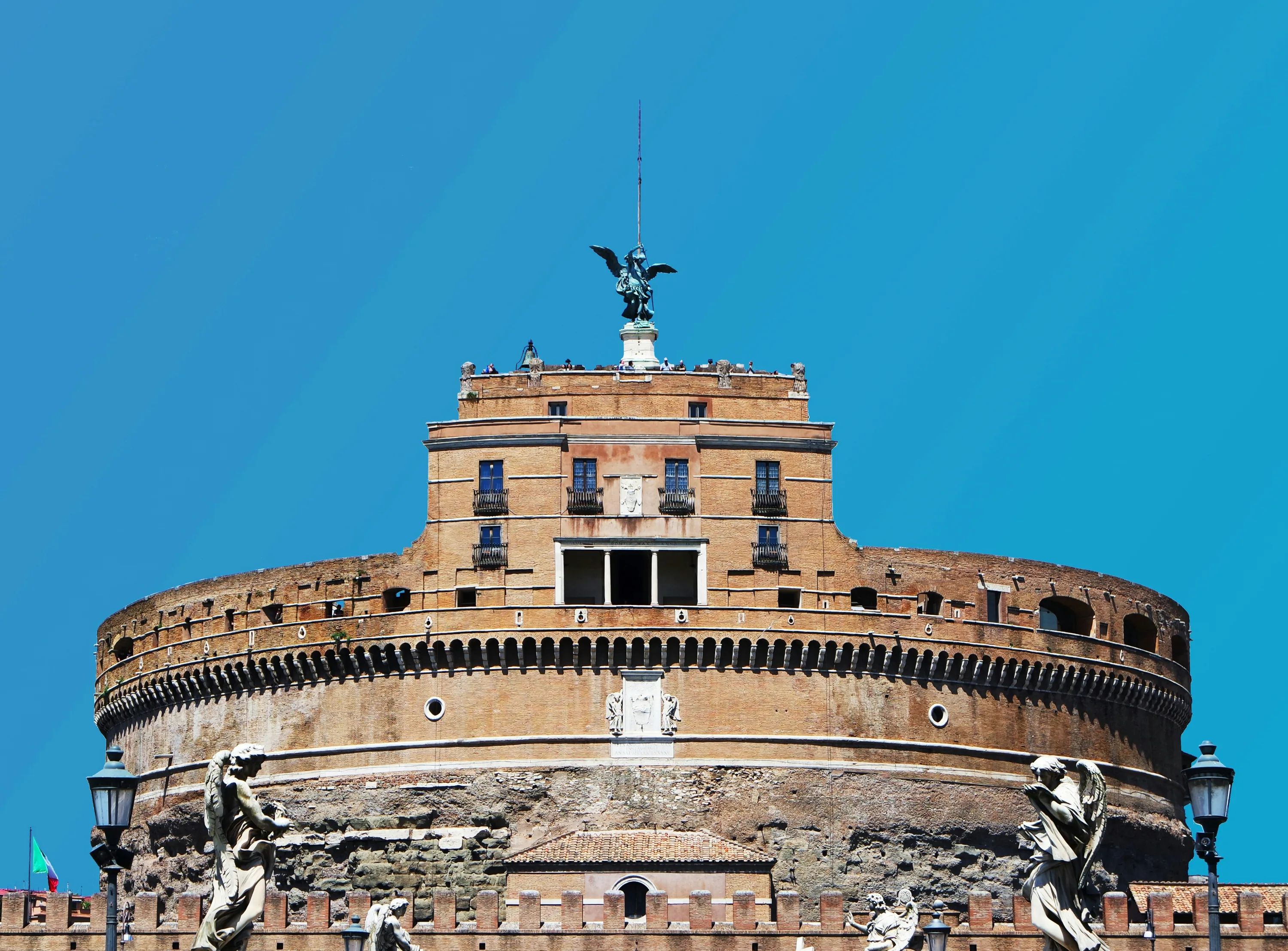 The top of the Castel Sant'Angelo in Rome, topped by a green Angel statue. 