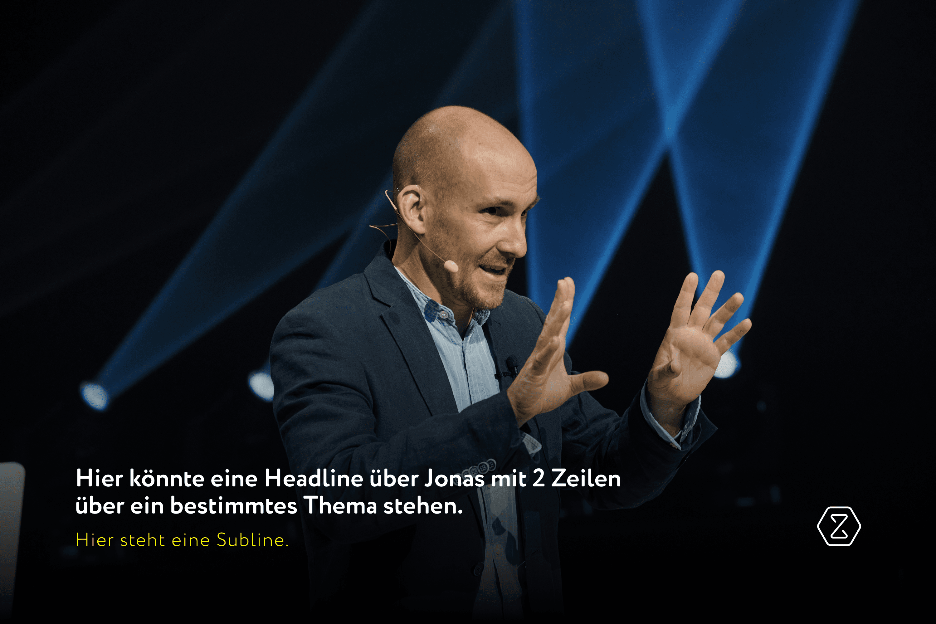 Man in suit with microphone talking