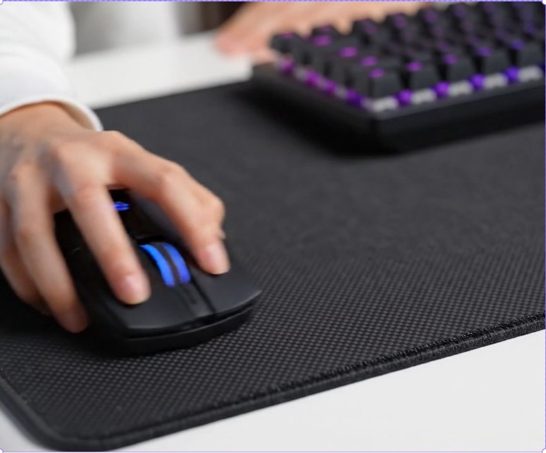 person holding black and gray computer mouse