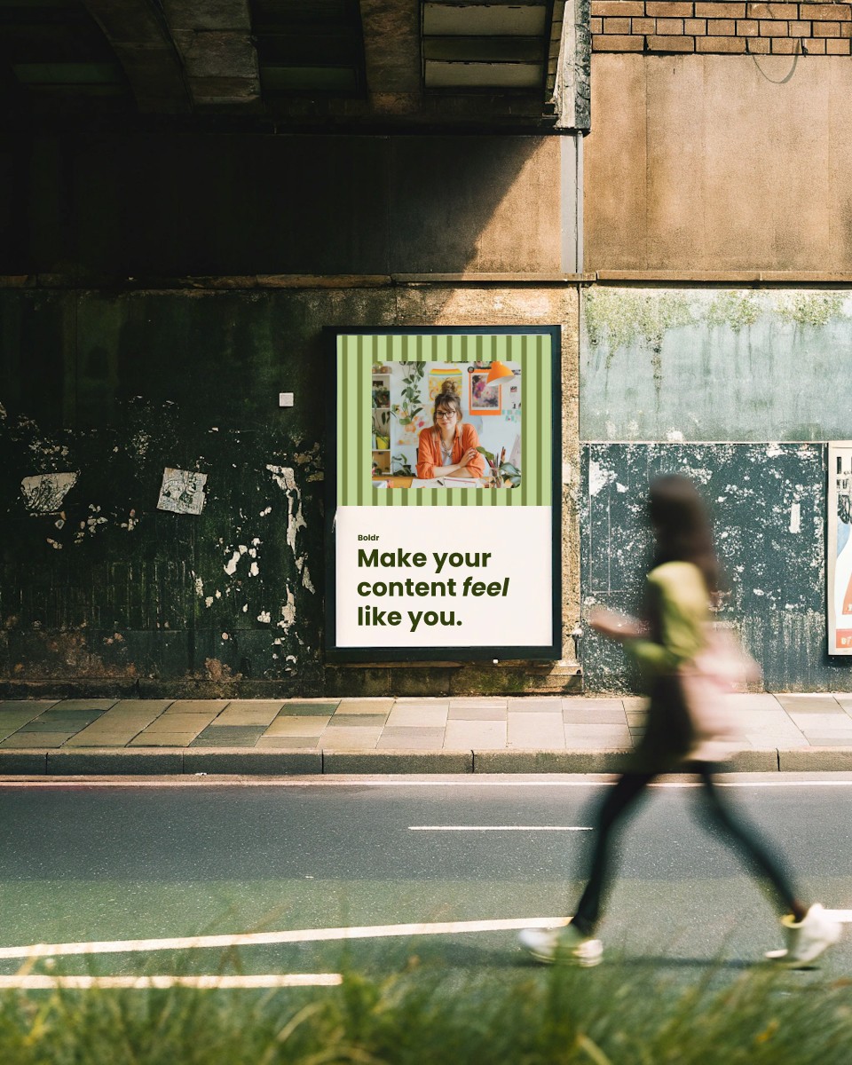 A woman walking past a bilboard sign.