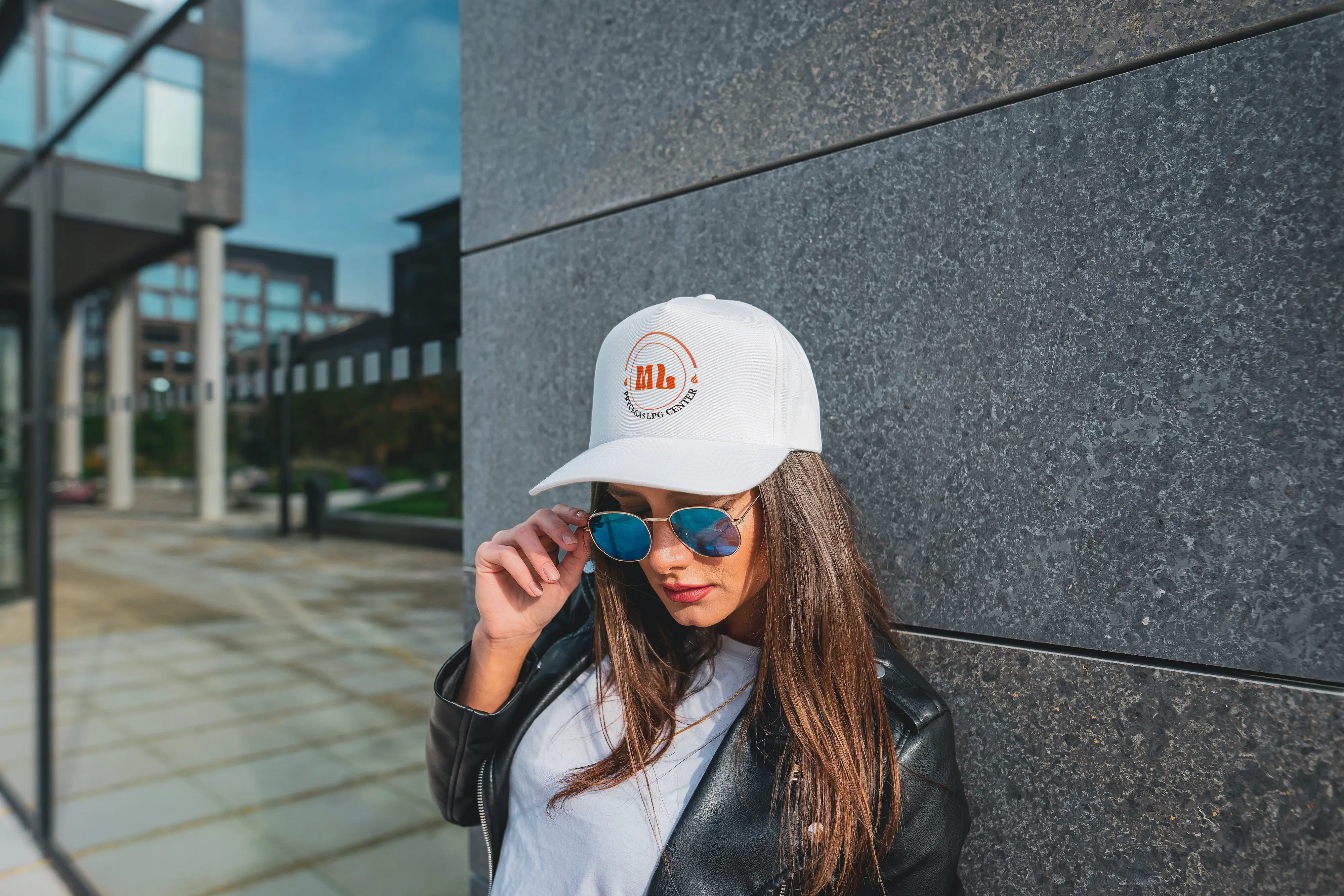 Girl with a white cap and the ml prycegas logo