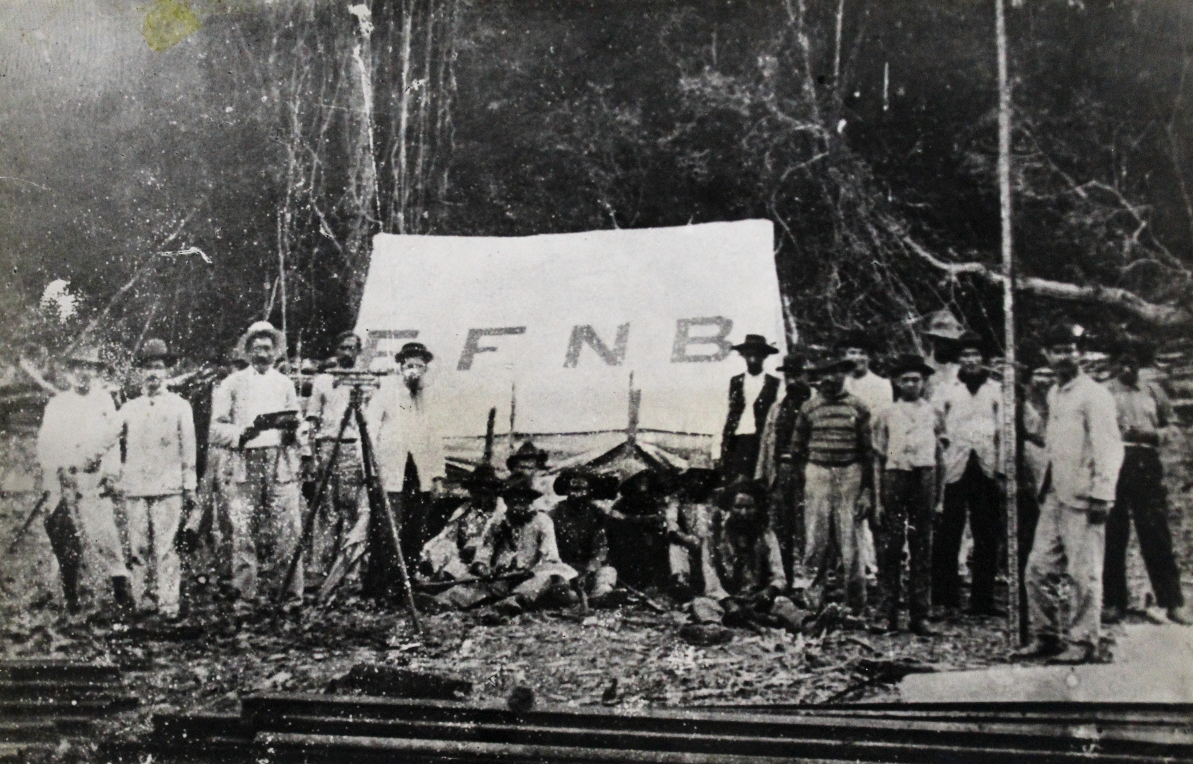 a black and white living room with a large tv