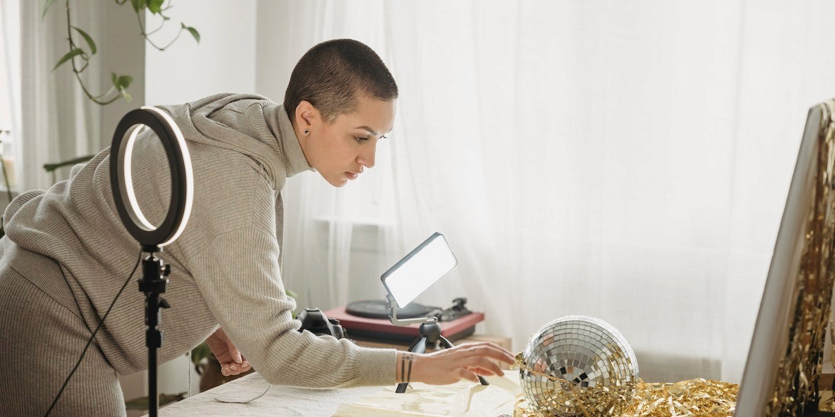 A woman setting up a photoshoot