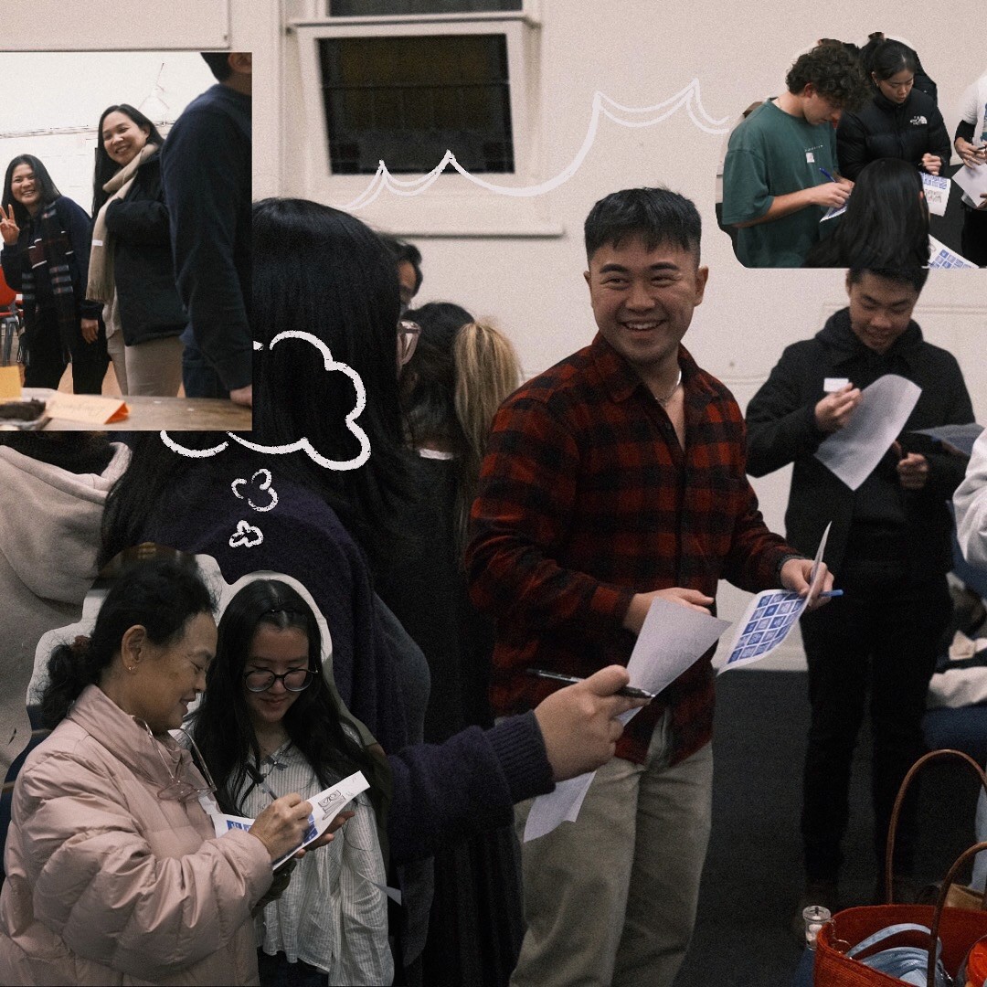 A restaurant interior featuring marble countertops, brown leather chairs, wood-paneled walls, and round pendant lights hanging above a bar set with wine glasses.