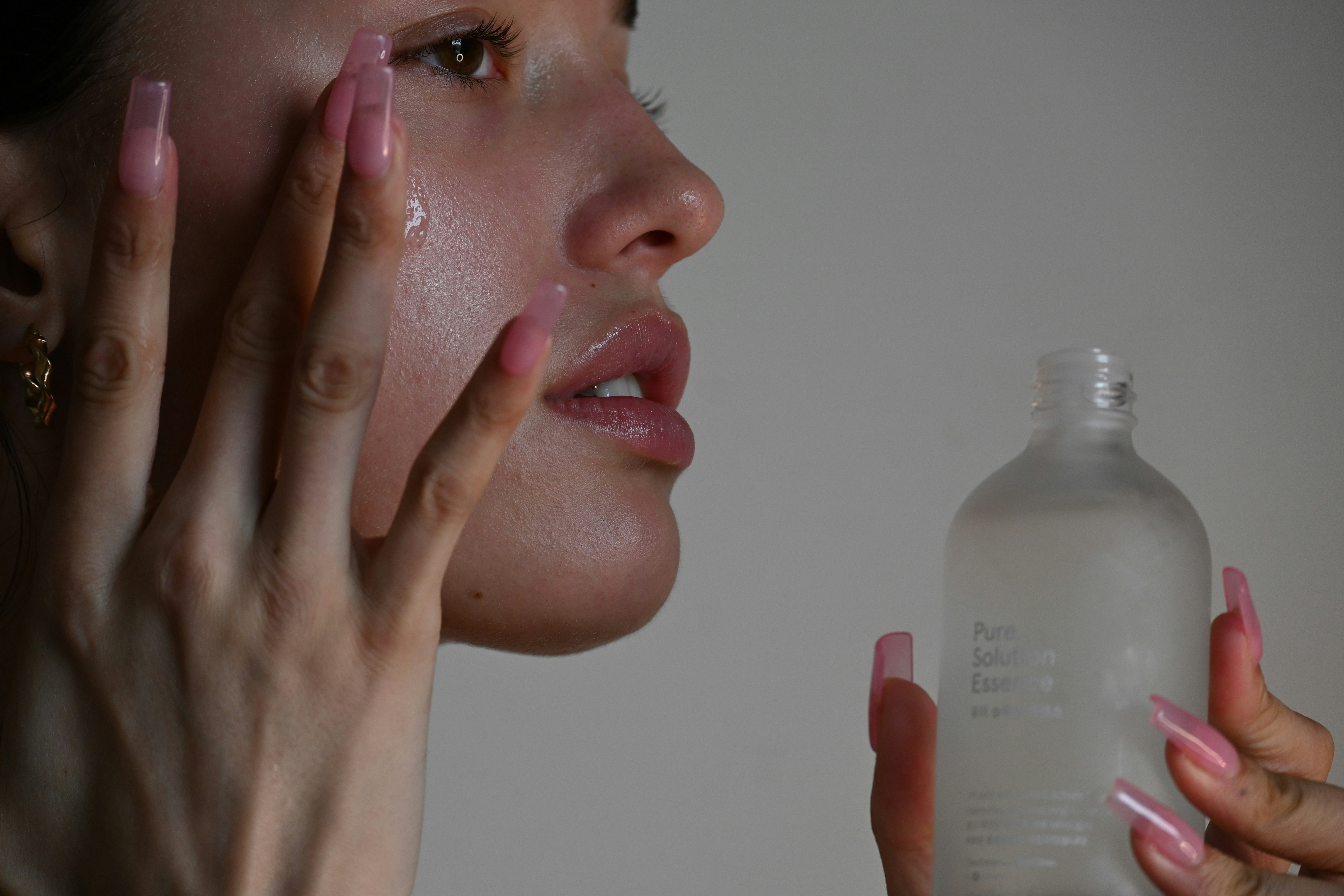 Girl applying Product on Face- Winter Skincare Routine