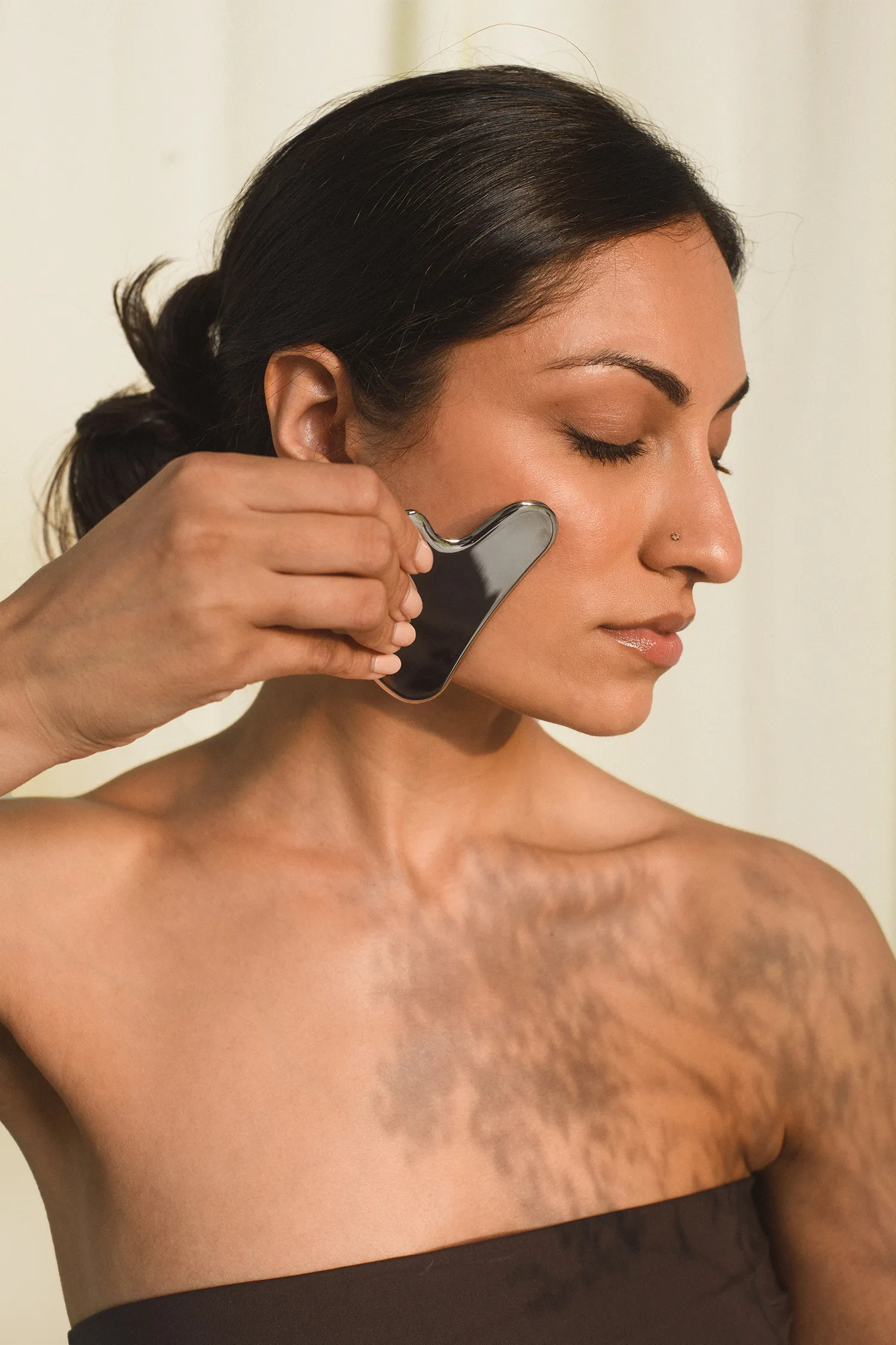 Woman with a gua sha