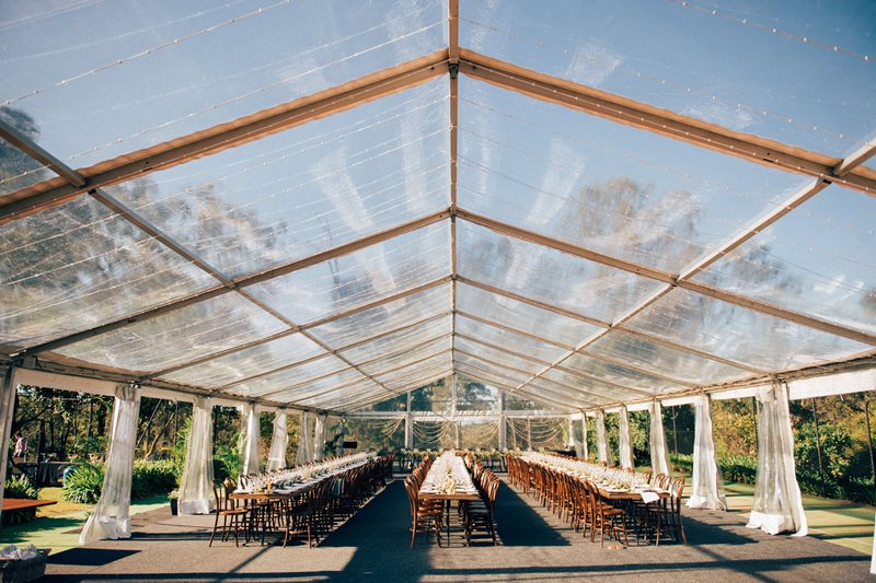 Wedding Reception outdoor under a clear roof marquee