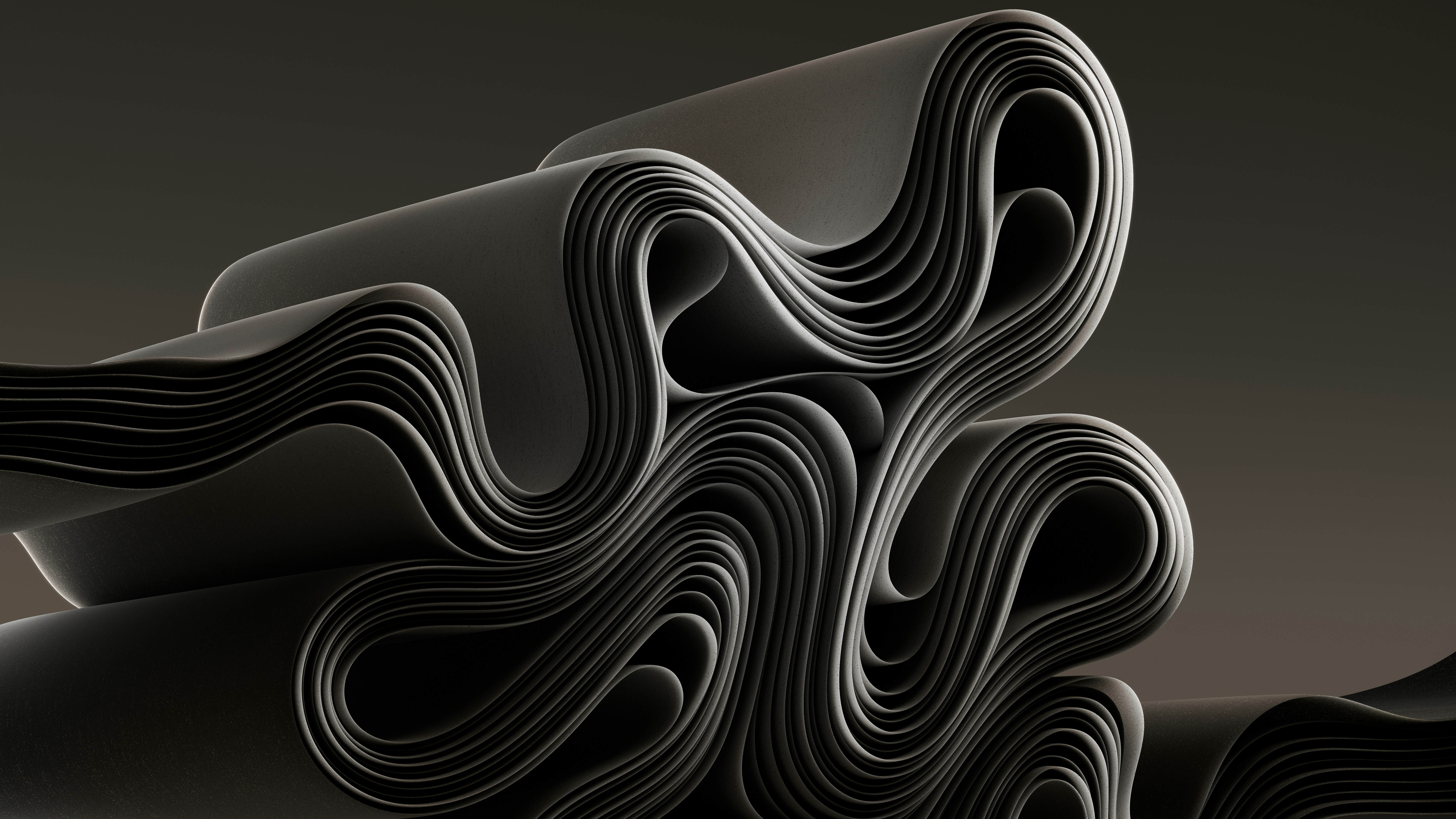 a stack of black paper sitting on top of a table