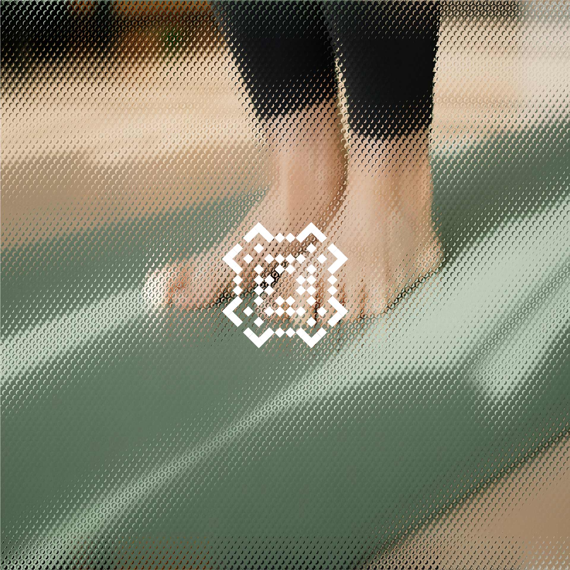 A person stands on tiptoe on a green yoga mat indoors, suggesting focus and balance during exercise.