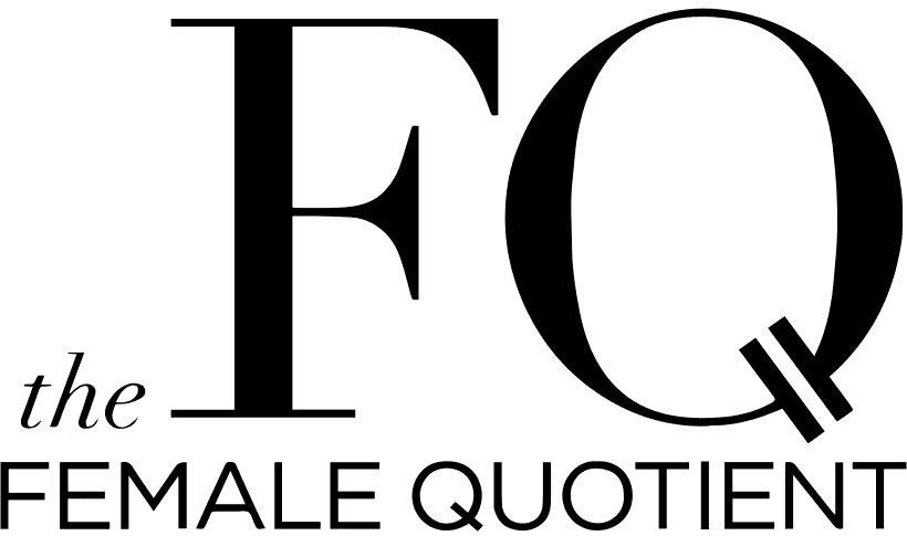 Smiling woman with long dark hair wearing grey shirt.