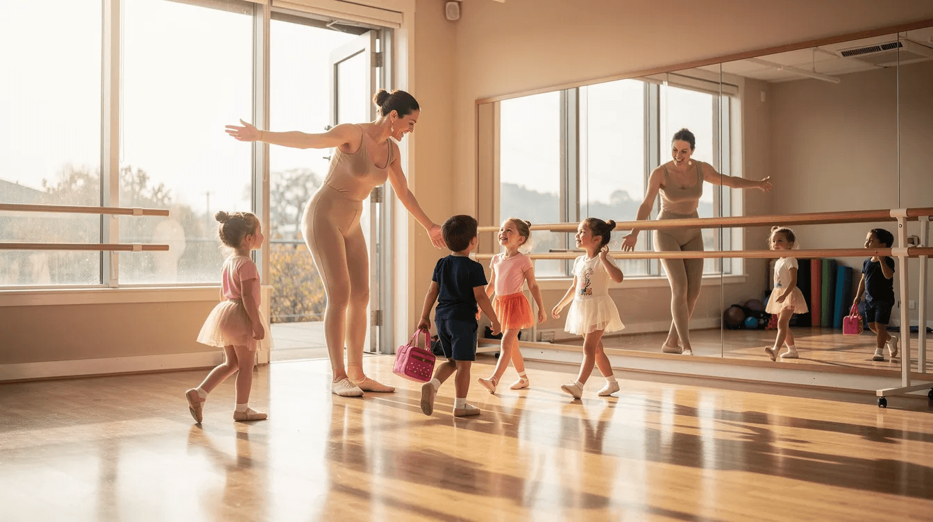 A dance instructor is warmly welcoming young students into a bright and cheerful studio, creating an inviting atmosphere for kids' classes. This scene highlights the importance of professional development and effective class scheduling in a vibrant educational environment.
