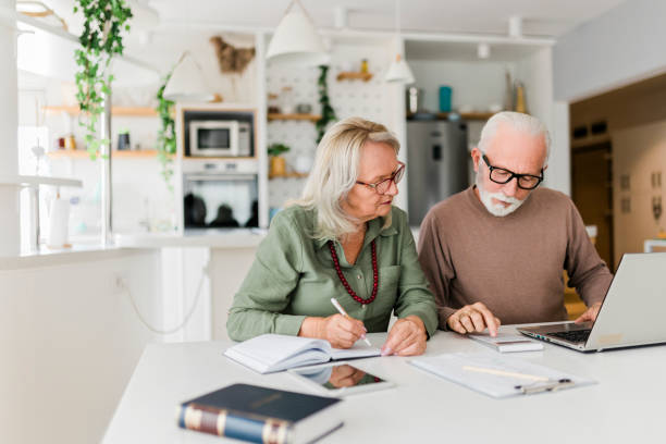     Pre-retiree reviewing calendar and financial documents before choosing a retirement date