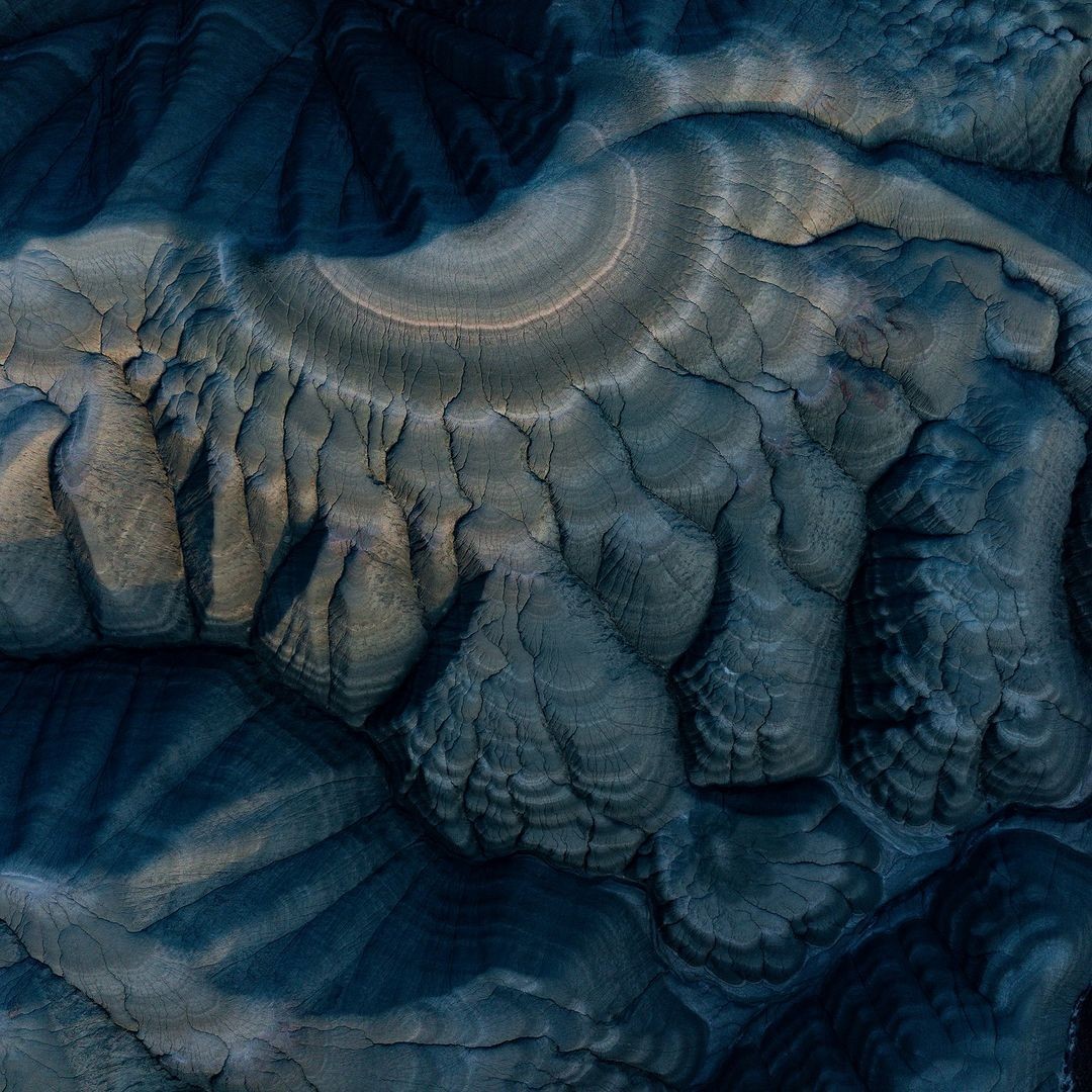 a black background with purple and orange shapes