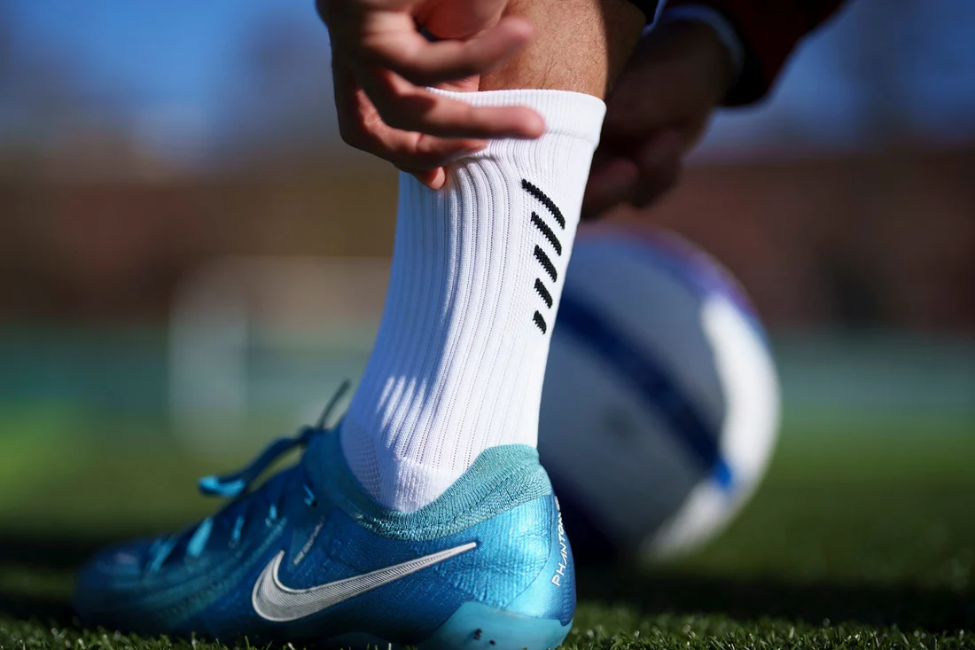 why footballers wear short socks, why soccer players cut socks, football short socks trend, grip socks football, football grip socks benefits, why pros wear grip socks, football socks cut at calves, soccer socks rules FIFA, short socks vs long socks football, calf compression football, football sock taping calves, football socks and blood flow, do footballers cut their socks, football sock comfort, grip socks vs team socks, football socks injury prevention, why do players wear grip socks, professional football sock trend, soccer sock rules explained, football sock performance benefits