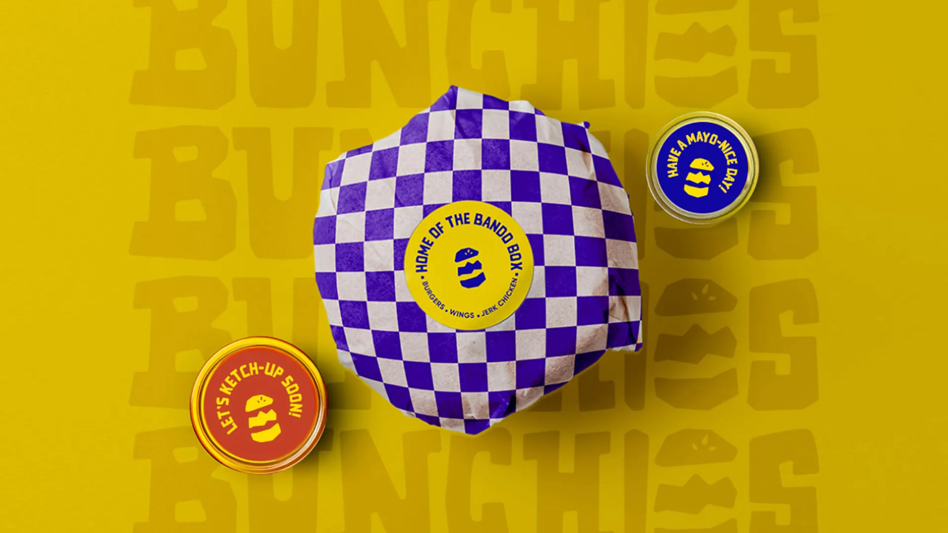 Bunchies burger packaging with purple checker wrap and branded dipping sauces on yellow background.
