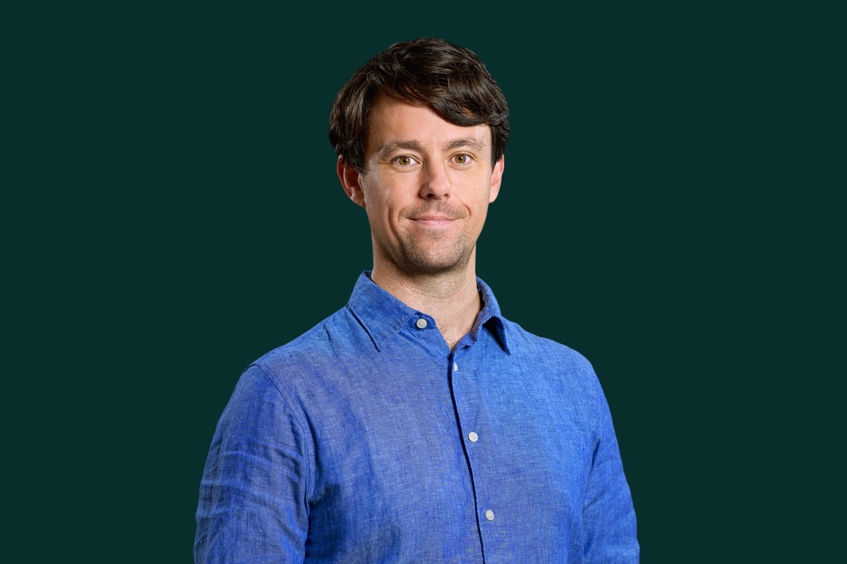 Diverse group of people in a modern office meeting.