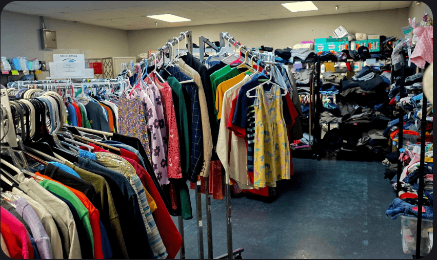 Racks and shelves filled with donated, lightly used clothing inside the Clothed in Kindness free clothing store, serving residents of Jefferson County, Indiana.