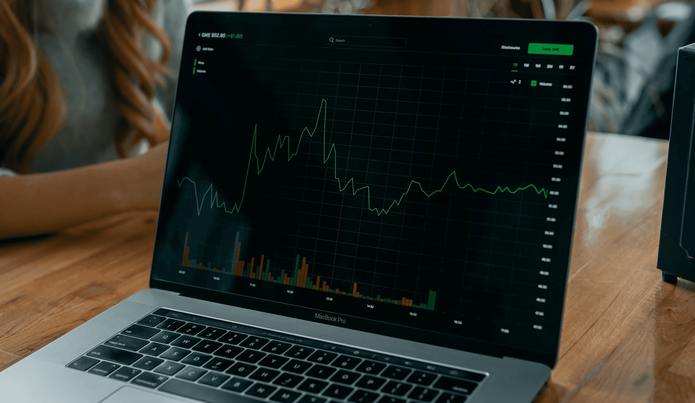 Laptop displaying stock market line graph - Best Time Frame for Crypto Trading