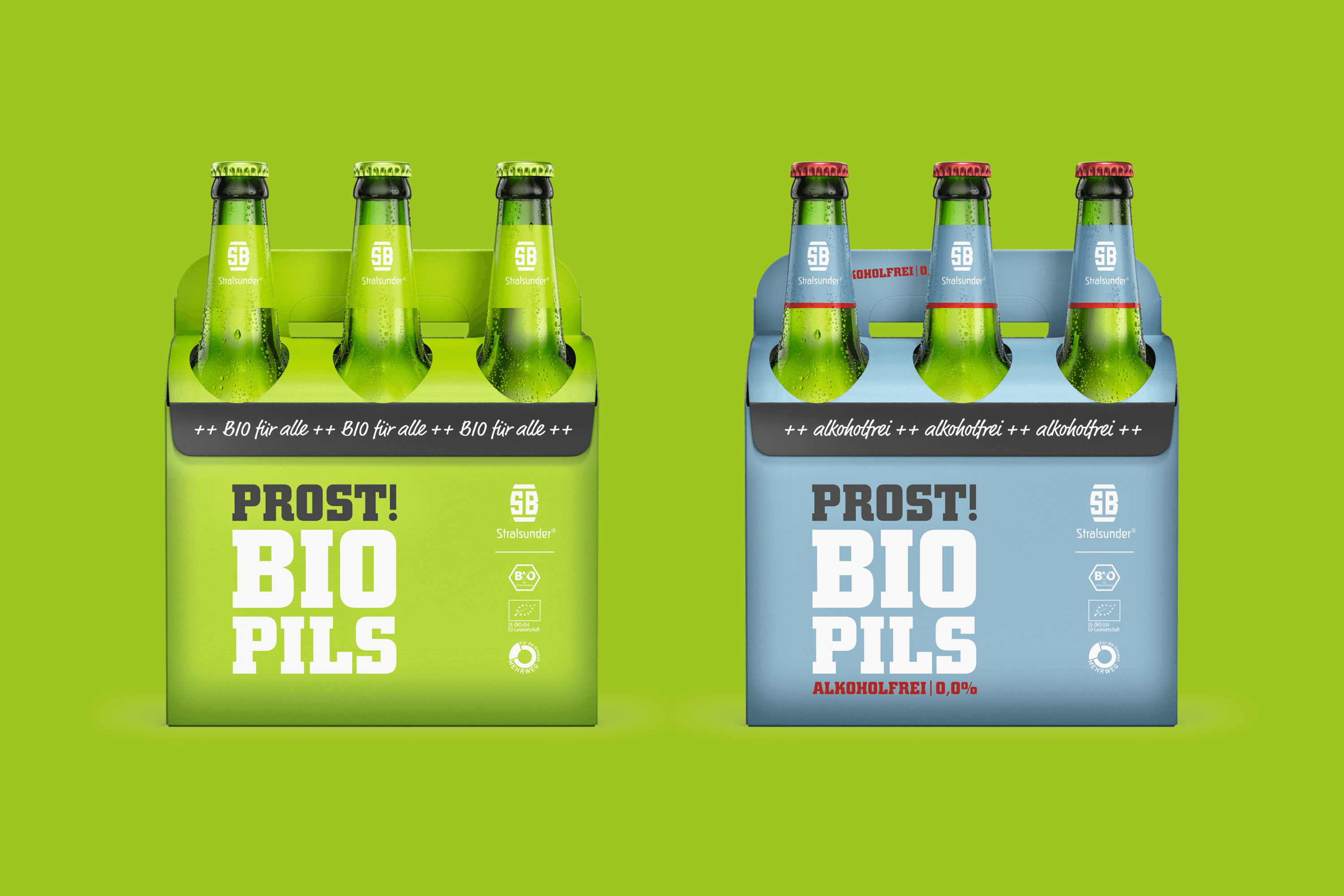 Four bottles of beer in two holders, one green and one blue